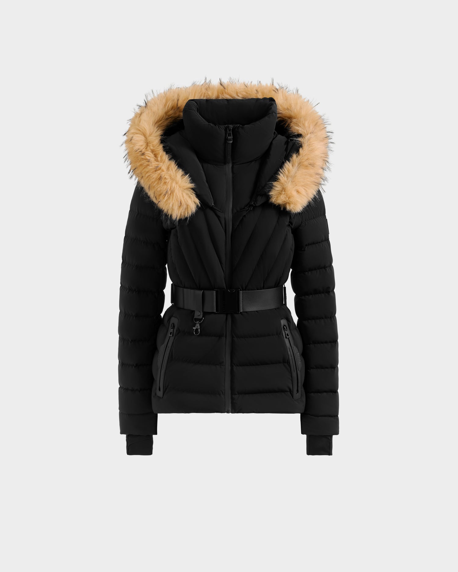 The Rudsak ALISA F - L125527 Black is a black quilted puffer jacket with a belted waist, zippered pockets, and a large hood trimmed in light brown faux fur, shown against a plain light gray background.