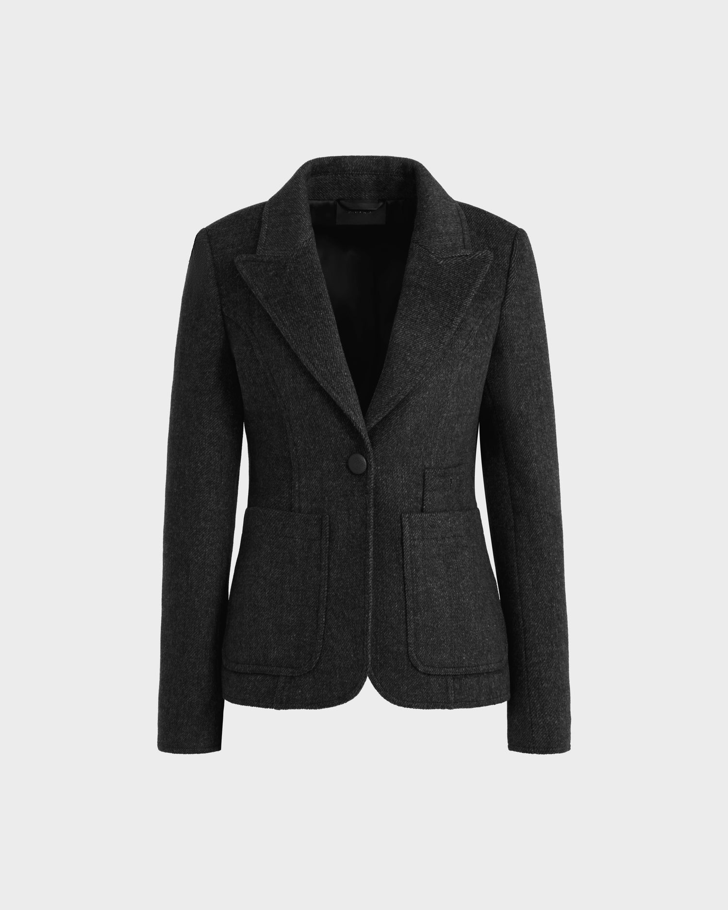 The ALVERO - 8525566 Grey by Rudsak is a women’s fitted charcoal wool-blend blazer featuring a single button closure, notched lapels, vegan leather elbow patches, and two front patch pockets, shown on a plain white background.