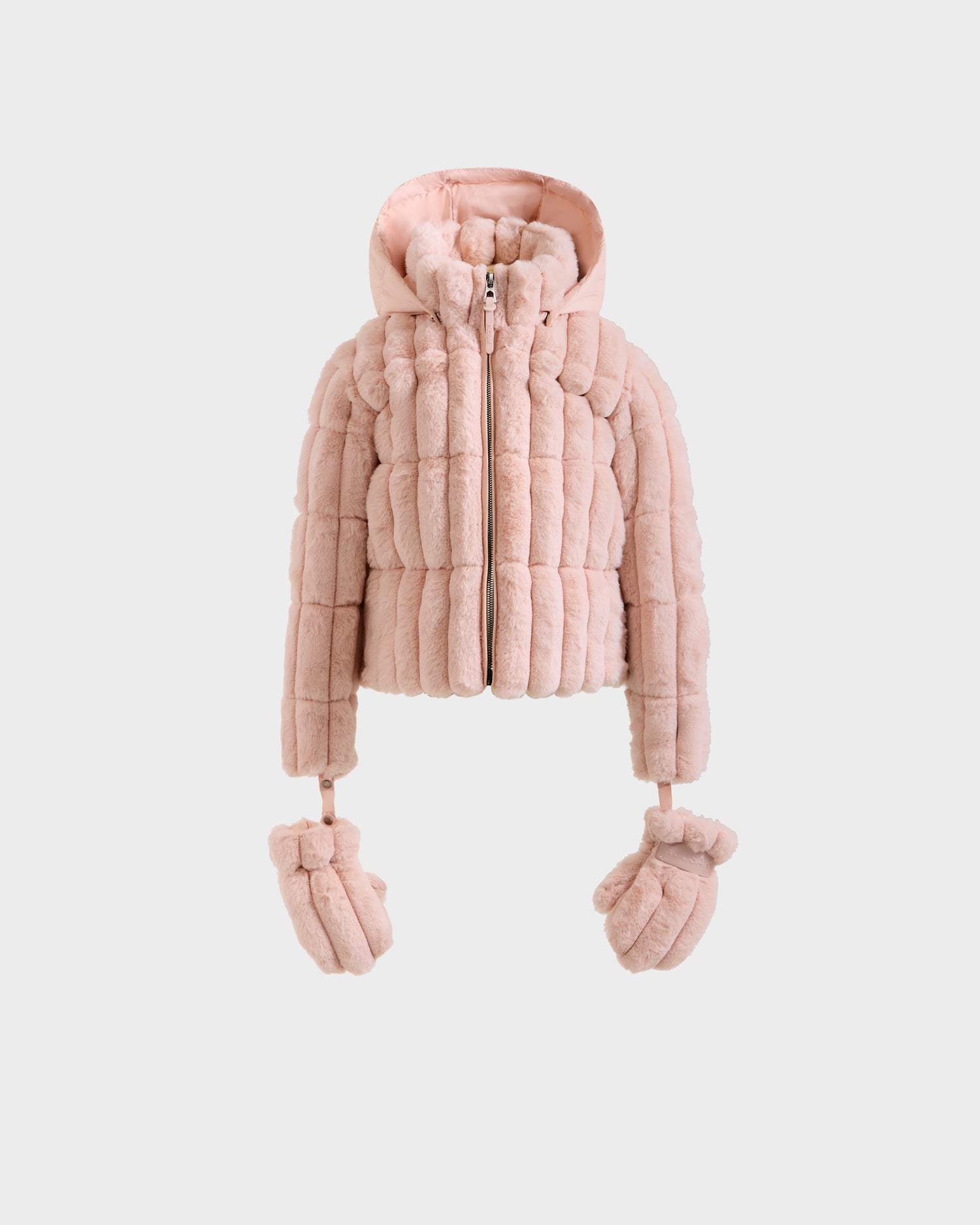 The Rudsak ANASTASIA K - 0125000 Pastel Pink is a girl's light pink puffer jacket with a quilted faux fur shell, cozy hood, front zipper, and detachable matching mittens hanging from the sleeves.
