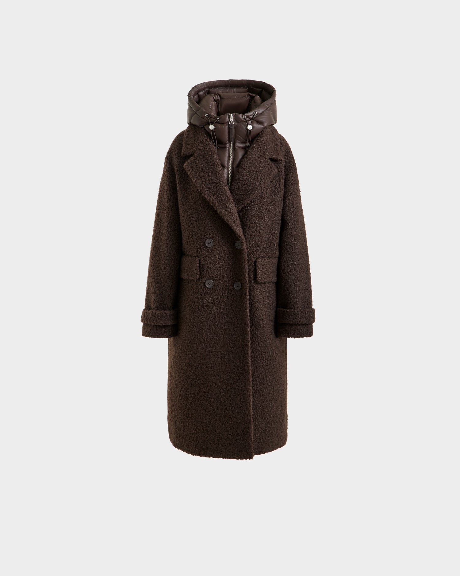 The ARABELLA - 8125621 Espresso by Rudsak is a long, dark brown women’s overcoat with textured fabric, button front, notched lapels, flap pockets, and a detachable puffer-style hood, shown against a plain white background.