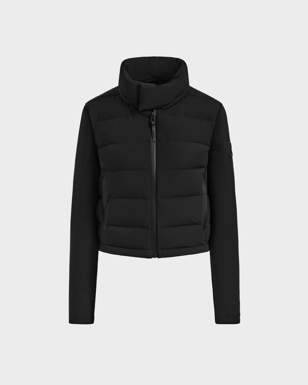 The Rudsak AUSHA - 8125026 Black is a women’s cropped down jacket with a high collar, front zipper, quilted chest details, and smooth sleeves, crafted from lightweight down and shown on a plain light background.