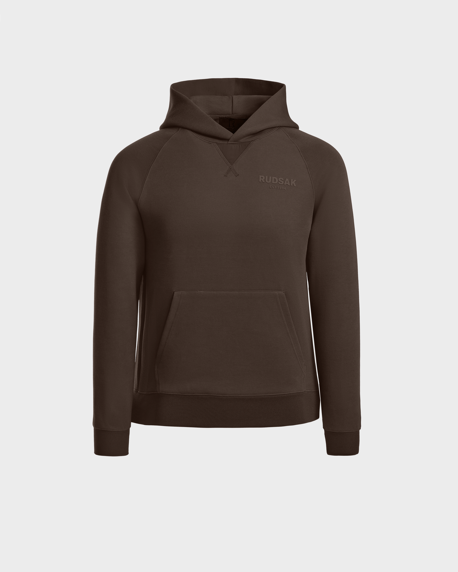 The Rudsak BARRY - 9524011 Espresso W hoodie features an oversized fit, long sleeves, a front kangaroo pocket, and subtle chest branding. This versatile unisex piece is shown against a plain light background.