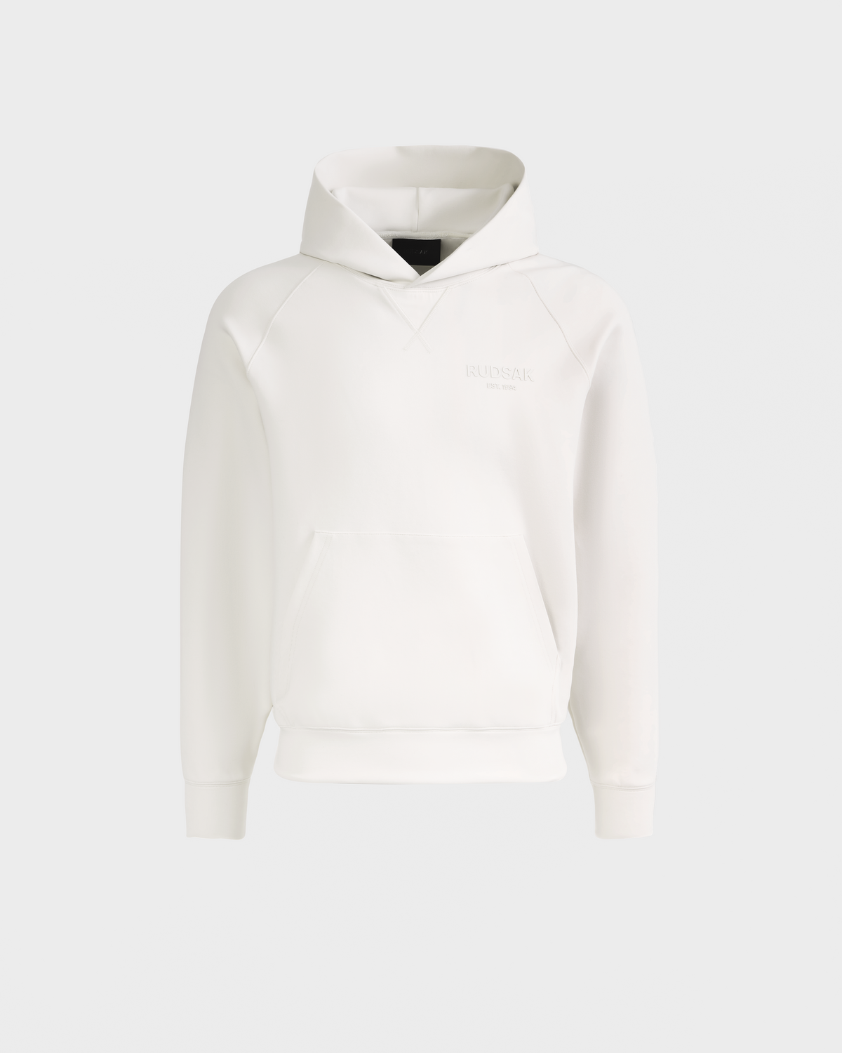 The Rudsak BARRY - 9524011 Vanilla M is a plain white unisex hoodie featuring a front pouch pocket and subtle chest logo, shown on a light gray background.