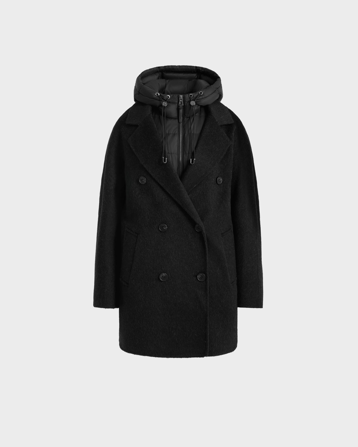 The Rudsak BETHANY - 8125625 Black is a double-breasted coat in wool-silk-yak with notched lapels, front flap pockets, and a detachable puffer hood, displayed as versatile modular outerwear against a plain light gray background.