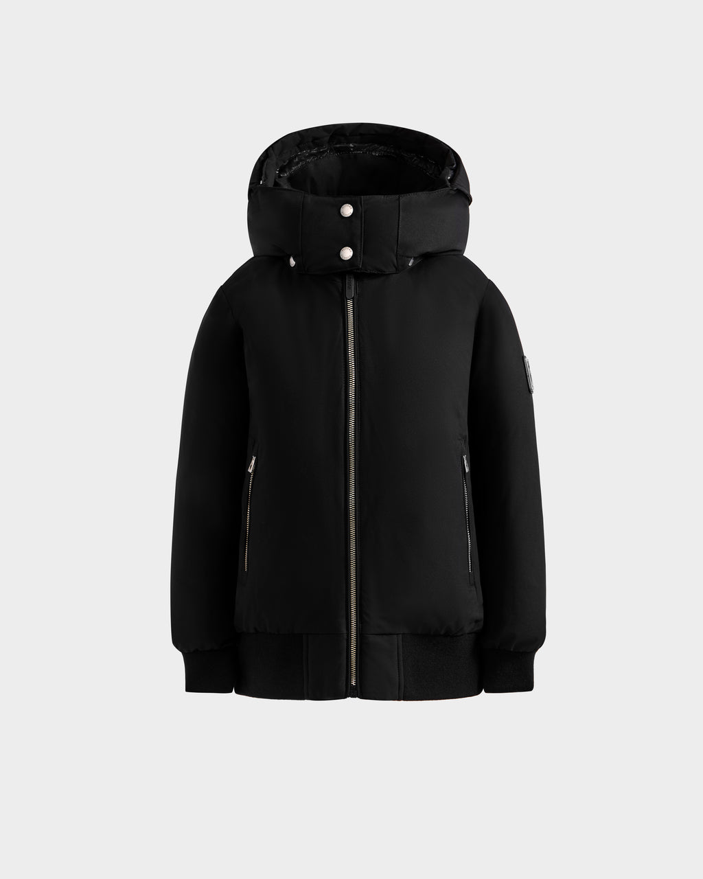The Rudsak BOOKER K - 0124500 Black is a weather-resistant kids' quilted puffer jacket with a front zipper, two zippered side pockets, and snap buttons on the collar, shown against a plain light gray background.