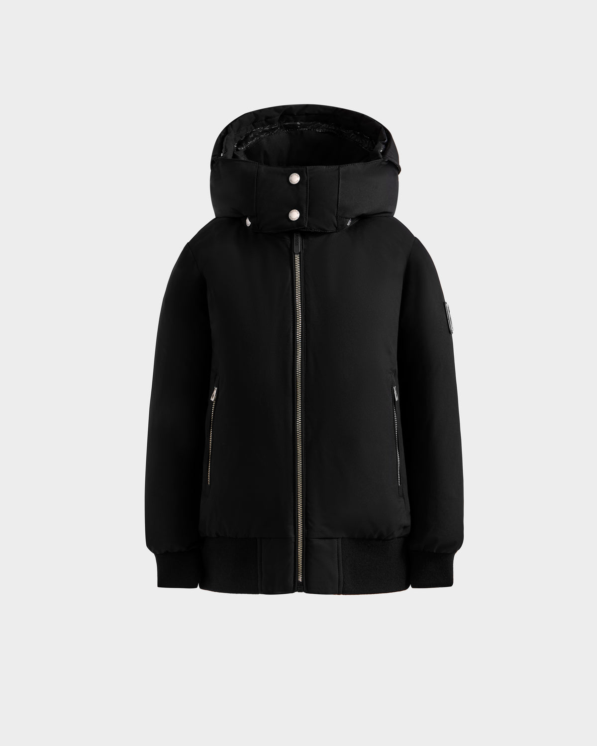The Rudsak BOOKER K - 0124500 Black is a weather-resistant kids' quilted puffer jacket with a front zipper, two zippered side pockets, and snap buttons on the collar, shown against a plain light gray background.