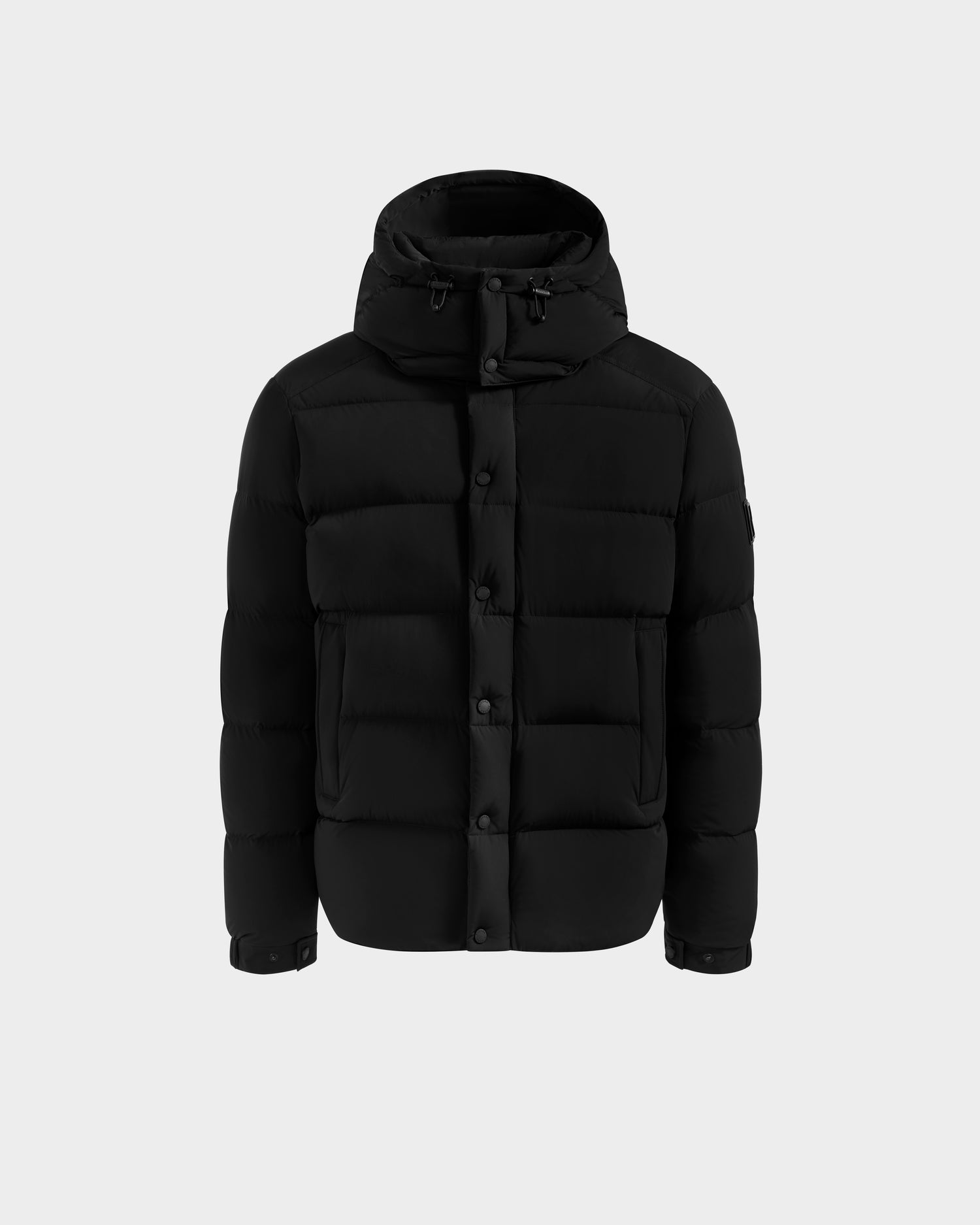 The Rudsak BRAYDEN M-S - M125524 Black is a men's down puffer jacket with a hood, front buttons, side pockets, and RDS-certified down, shown against a plain light background.