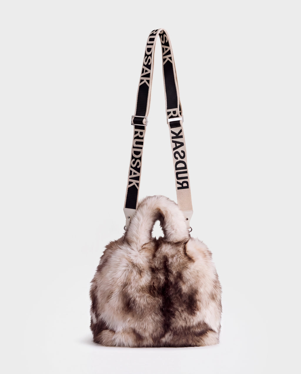 A fluffy, multi-toned CABAS - 8325545 Mix Vanilla faux fur mini tote featuring two top handles and a long, branded adjustable shoulder strap to complete your winter layers.