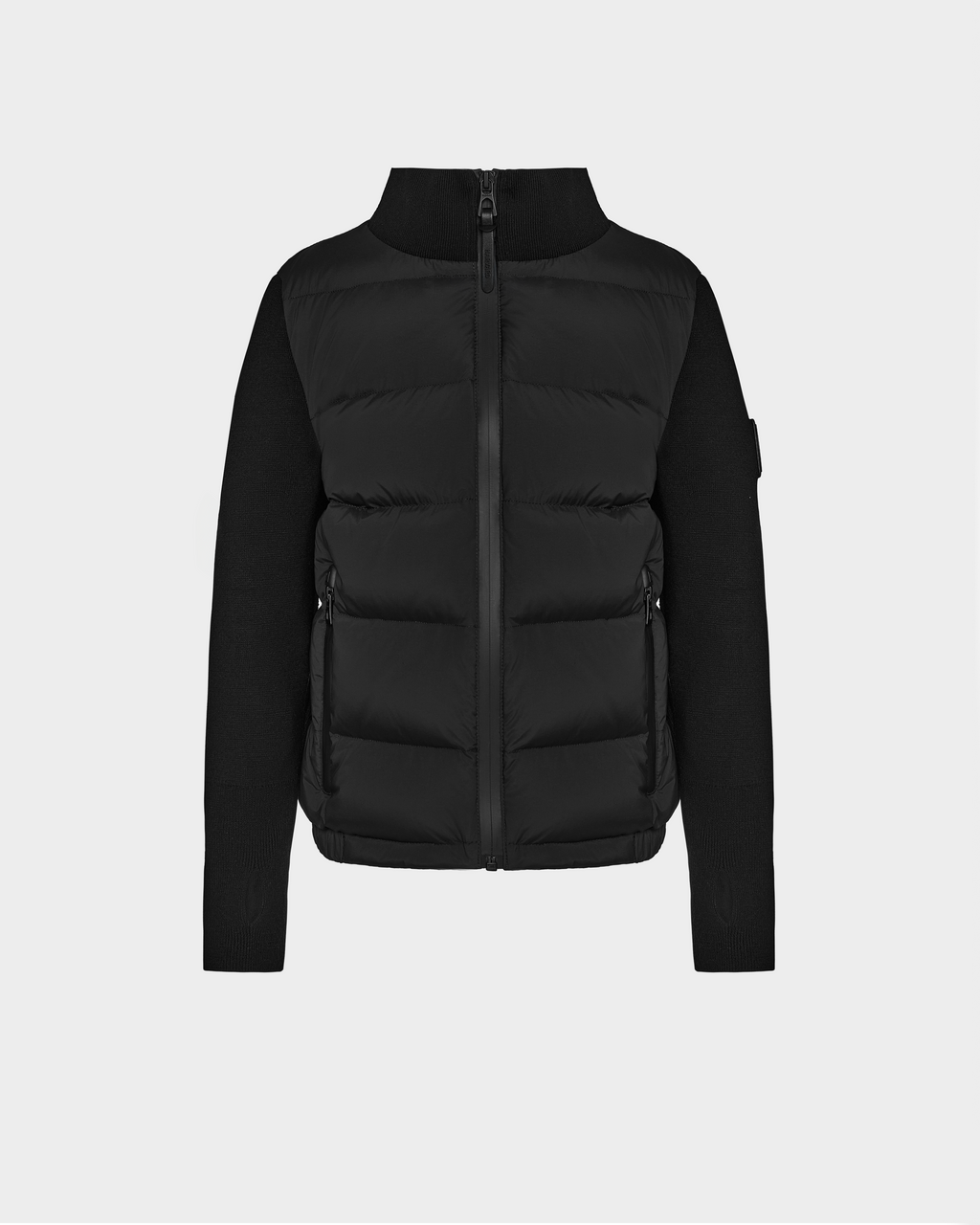 The Rudsak CAMILLE HV - H125500 Black puffer jacket features a front zipper, high collar, and knit sleeves. With a quilted, padded body for warmth and structure, this jacket is displayed on a plain white background.
