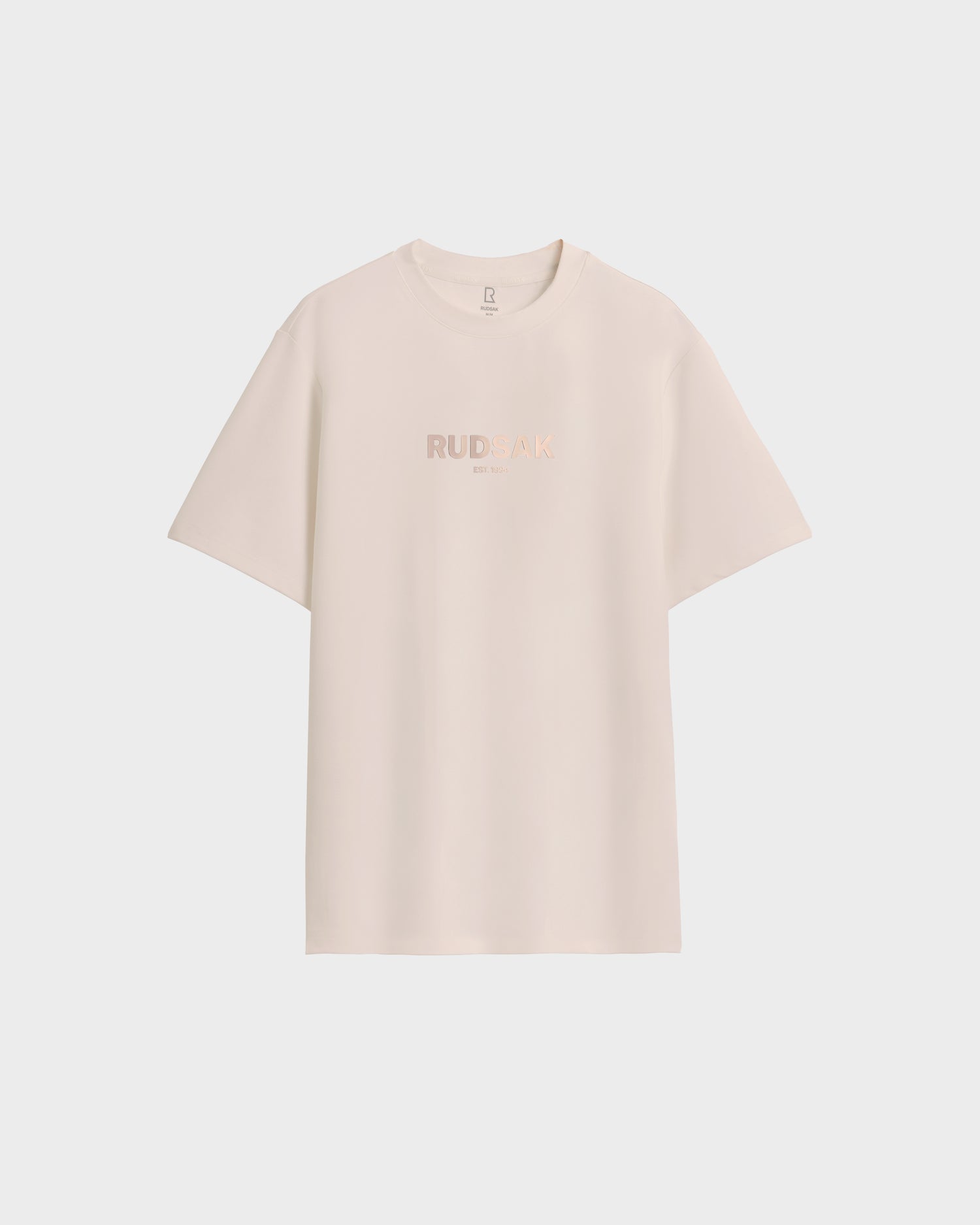 The Rudsak CASEY - 6525037 Vanilla mens T-shirt in off-white features subtle front branding, short sleeves, and a timeless clean design. Displayed on a white background.