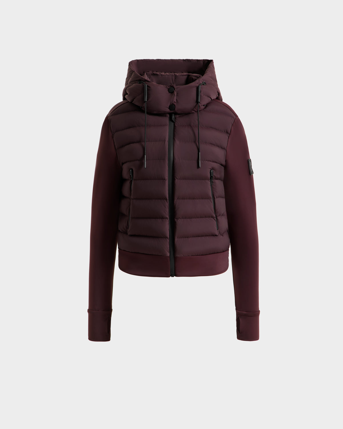 The Rudsak CASSA - 8125057 Bordeaux women's jacket features a hood, front zipper, and side pockets. Displayed on a plain light gray background, this lightweight cropped jacket offers versatile style and practicality.