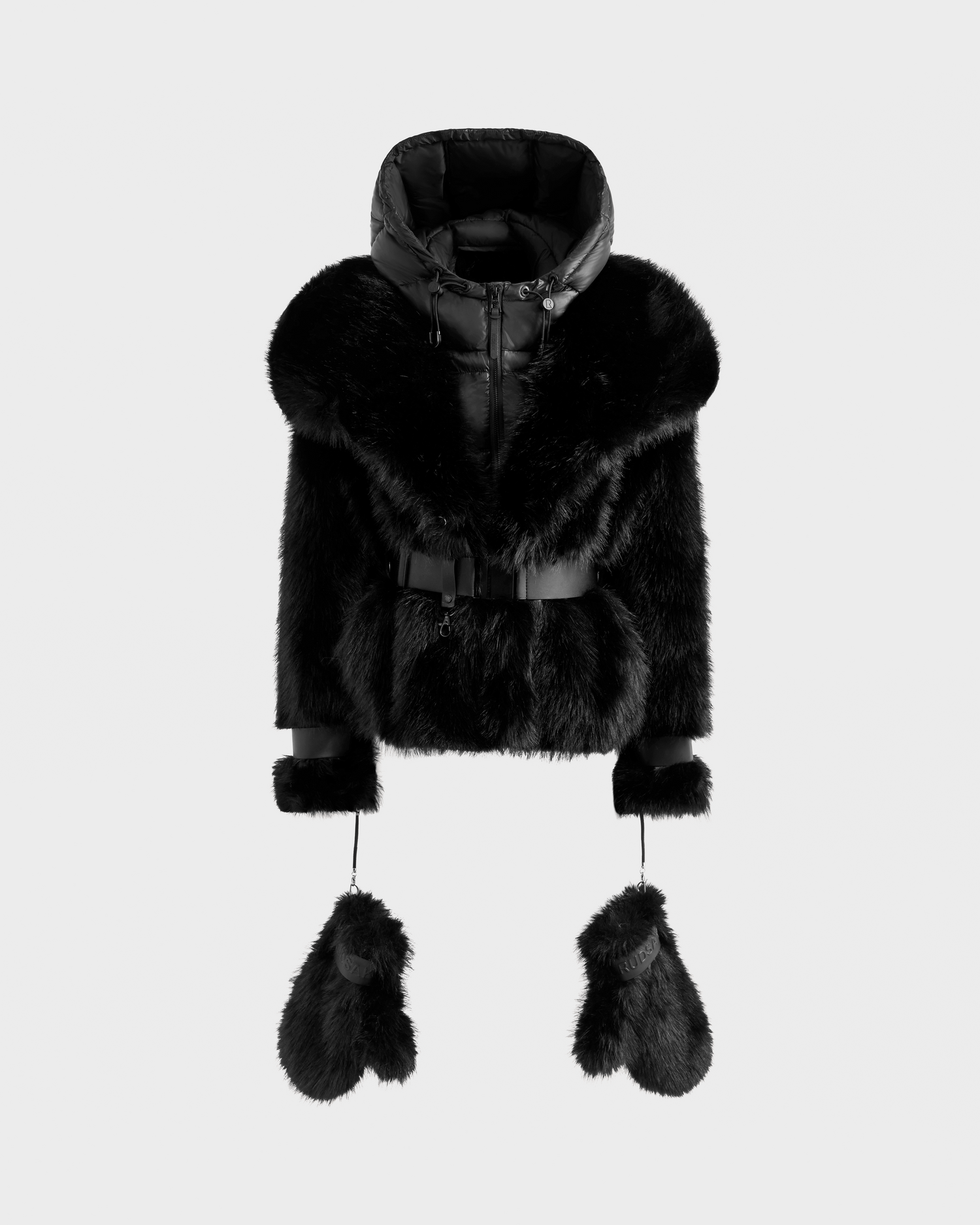 The Rudsak CHLOE - 8125619 Black is a luxurious women’s faux fur jacket with a large hood, wide collar, belted waist, and matching fur mittens attached by cords—an elegant upgrade for your winter wardrobe.