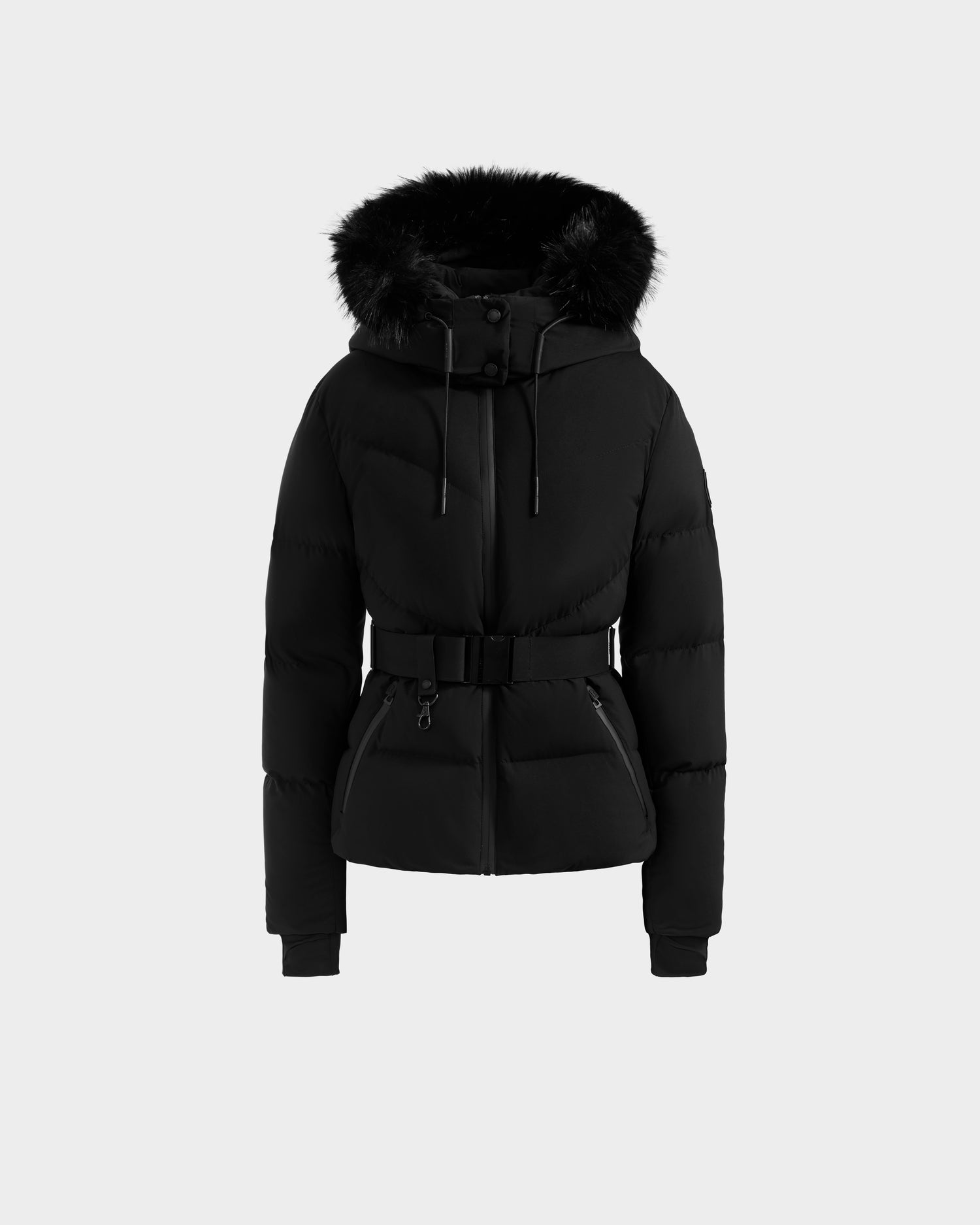 The CHRISTELLE M - L125542 Black by Rudsak is a black, padded winter jacket with weather-resistant recycled shell, quilted down puffer design, faux fur-trimmed hood, front zipper, snap buttons, belted waist, and two pockets. Shown on white background.