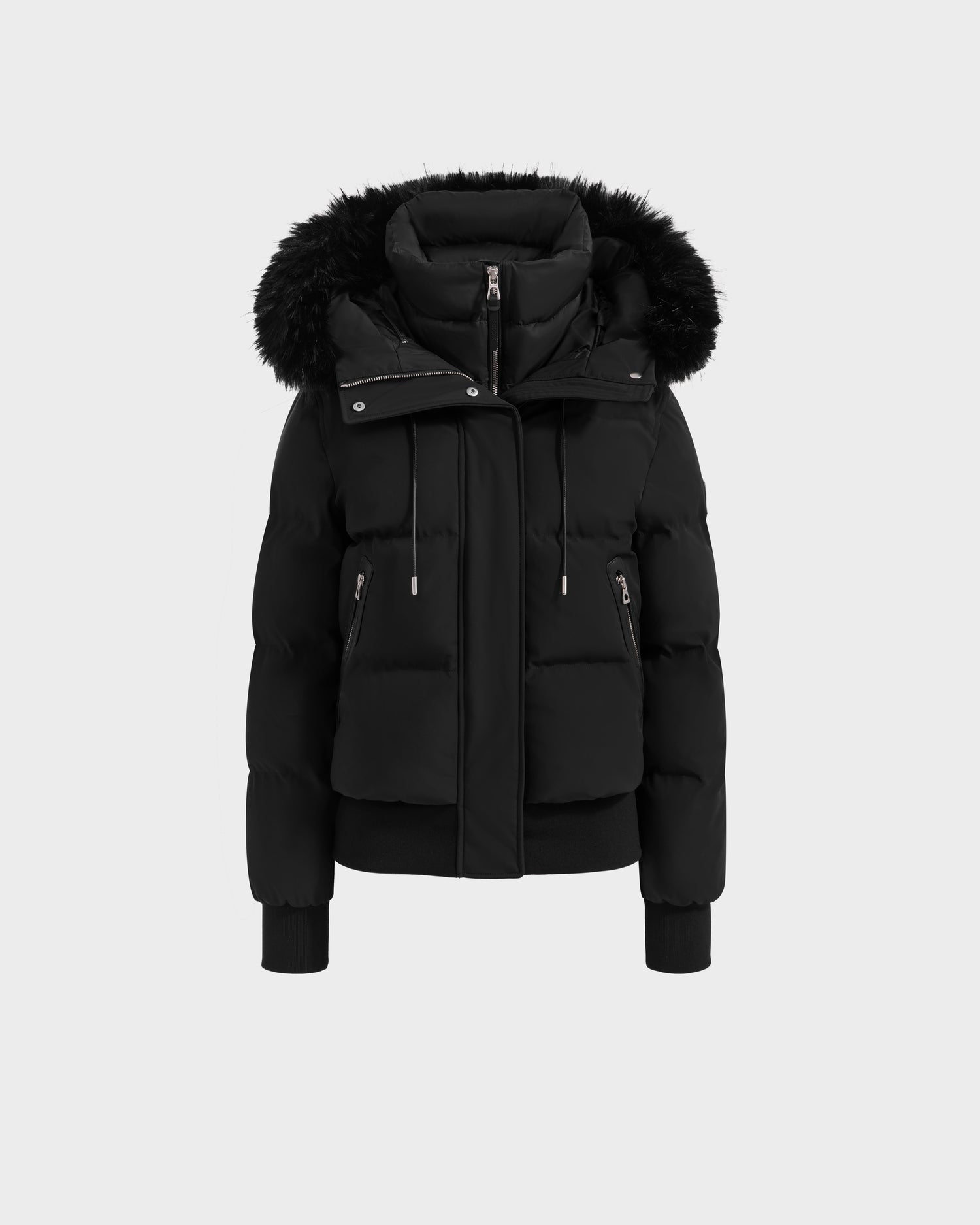 The Rudsak CIEYNA - 8125579 Black is a black down-filled bomber featuring a fur-trimmed hood, zip and snap closures, drawstrings, ribbed cuffs, and two large front pockets, shown on a plain white background.