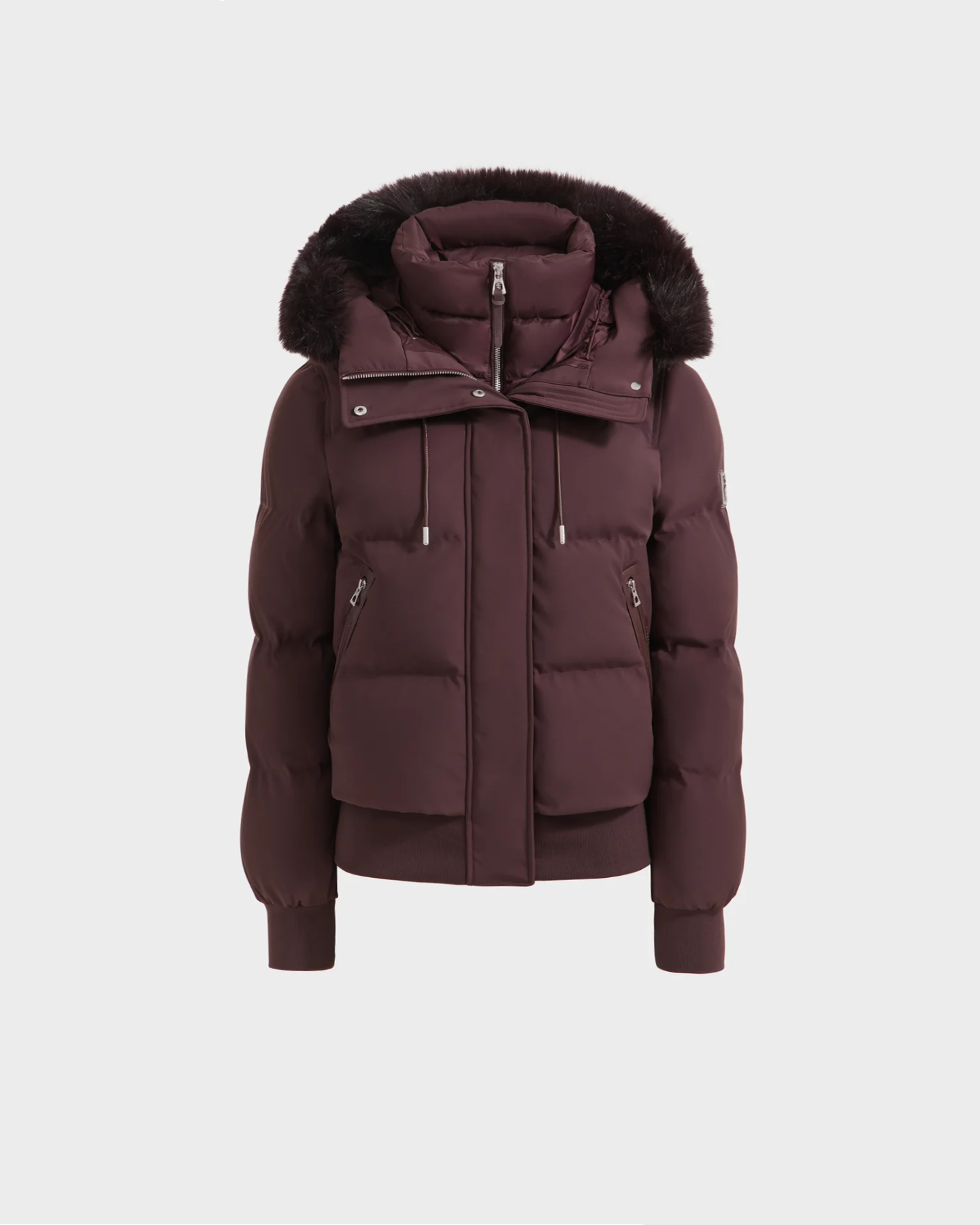 The Rudsak CIEYNA - 8125579 Bordeaux jacket, shown on a plain white background, features a weather-resistant maroon finish, high collar, detachable fur-lined hood, front zipper, large flap pockets, and ribbed cuffs and hem.