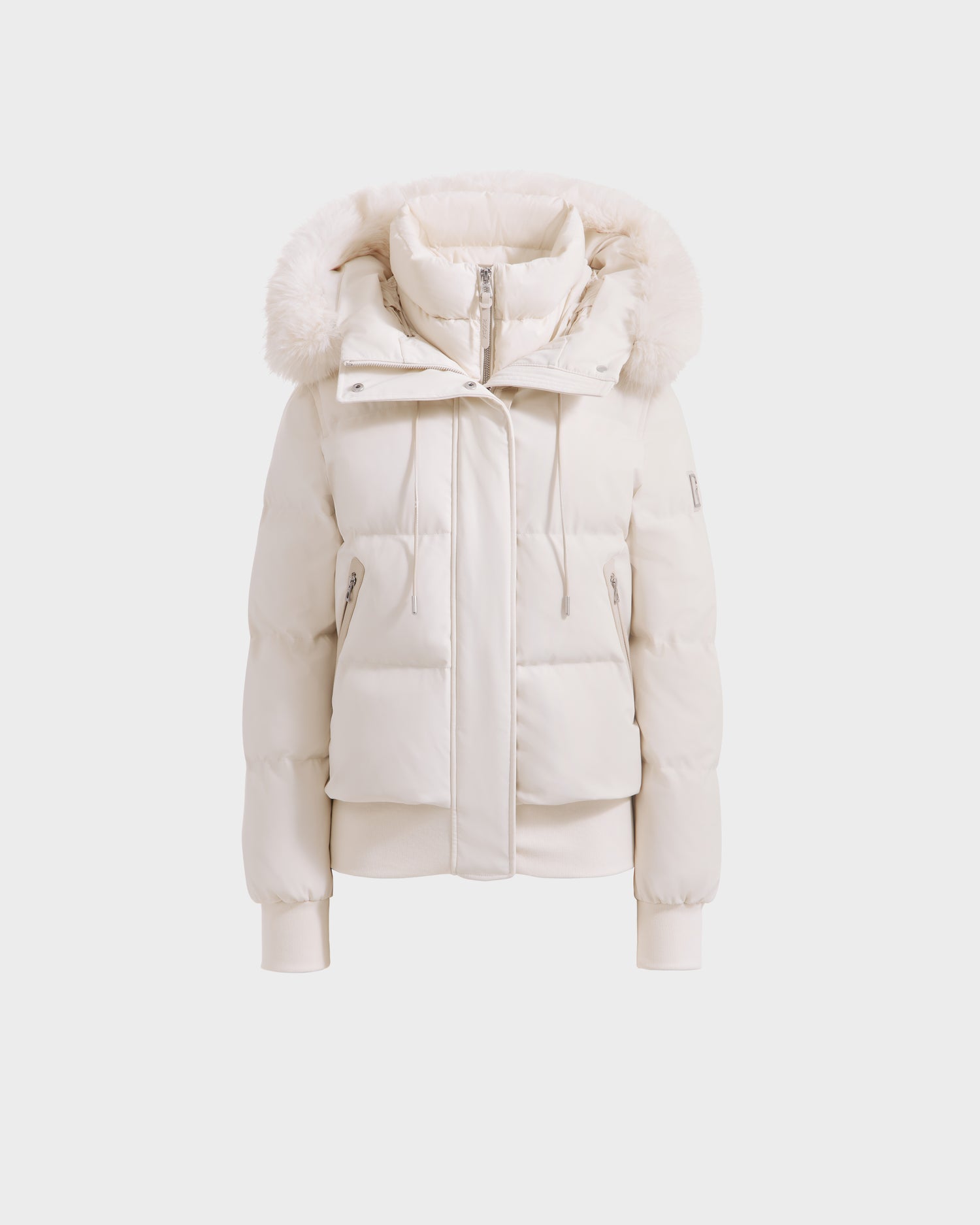 The CIEYNA - 8125579 Vanilla by Rudsak is a white, weather-resistant puffer jacket with a furry hood, high collar, front zipper, ribbed cuffs and hem, and two zipped side pockets shown on a plain white background.