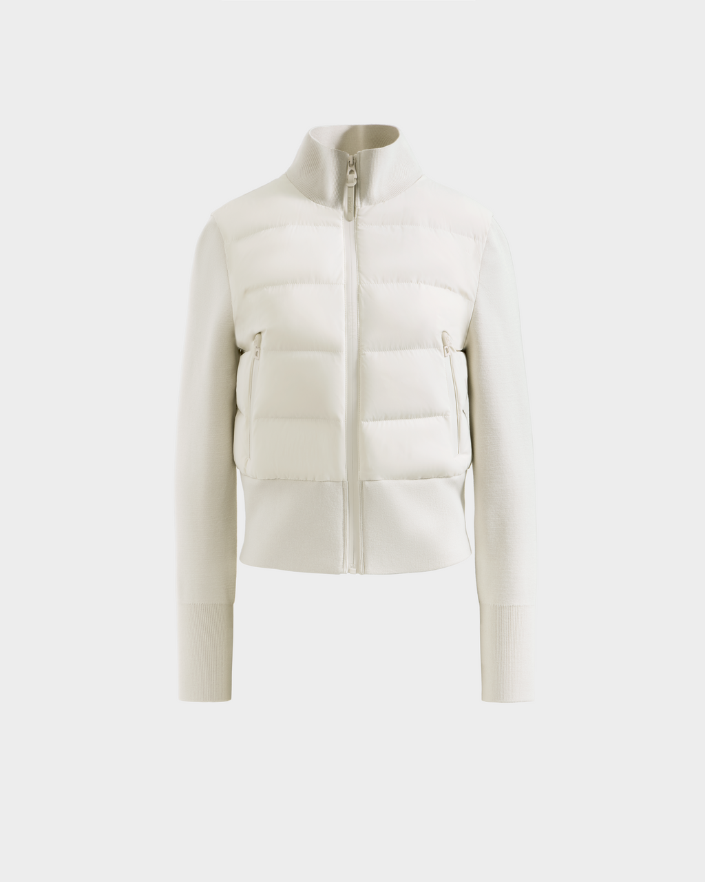 The Rudsak CLAREMONT - 8125502 Vanilla is a cream-colored women’s short down jacket with long sleeves, zip-up front, high collar, and ribbed cuffs for lightweight warmth, shown on a plain white background.