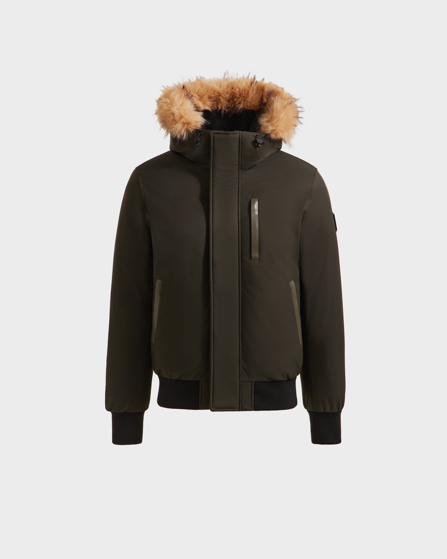 The Rudsak DEACON - M123513 Dark Olive is a dark green bomber-style down puffer with a front zipper, zippered side pockets, chest pocket, and hood with brown faux fur trim, shown on a plain white background.