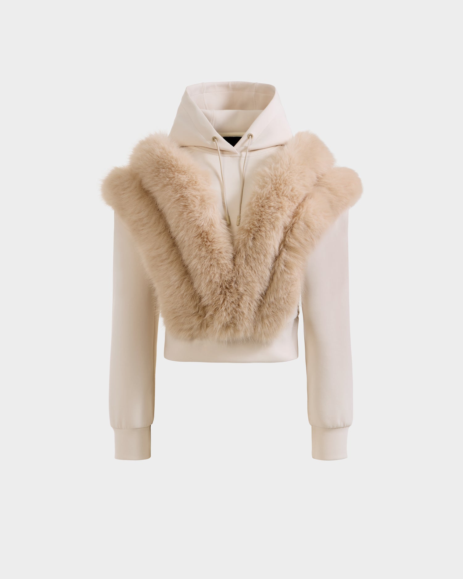 The DELLA - 8525668 Vanilla by Rudsak is a cream cropped women’s hoodie with a plush tan faux fur V-shaped trim, ideal for après-ski, shown against a plain white background.