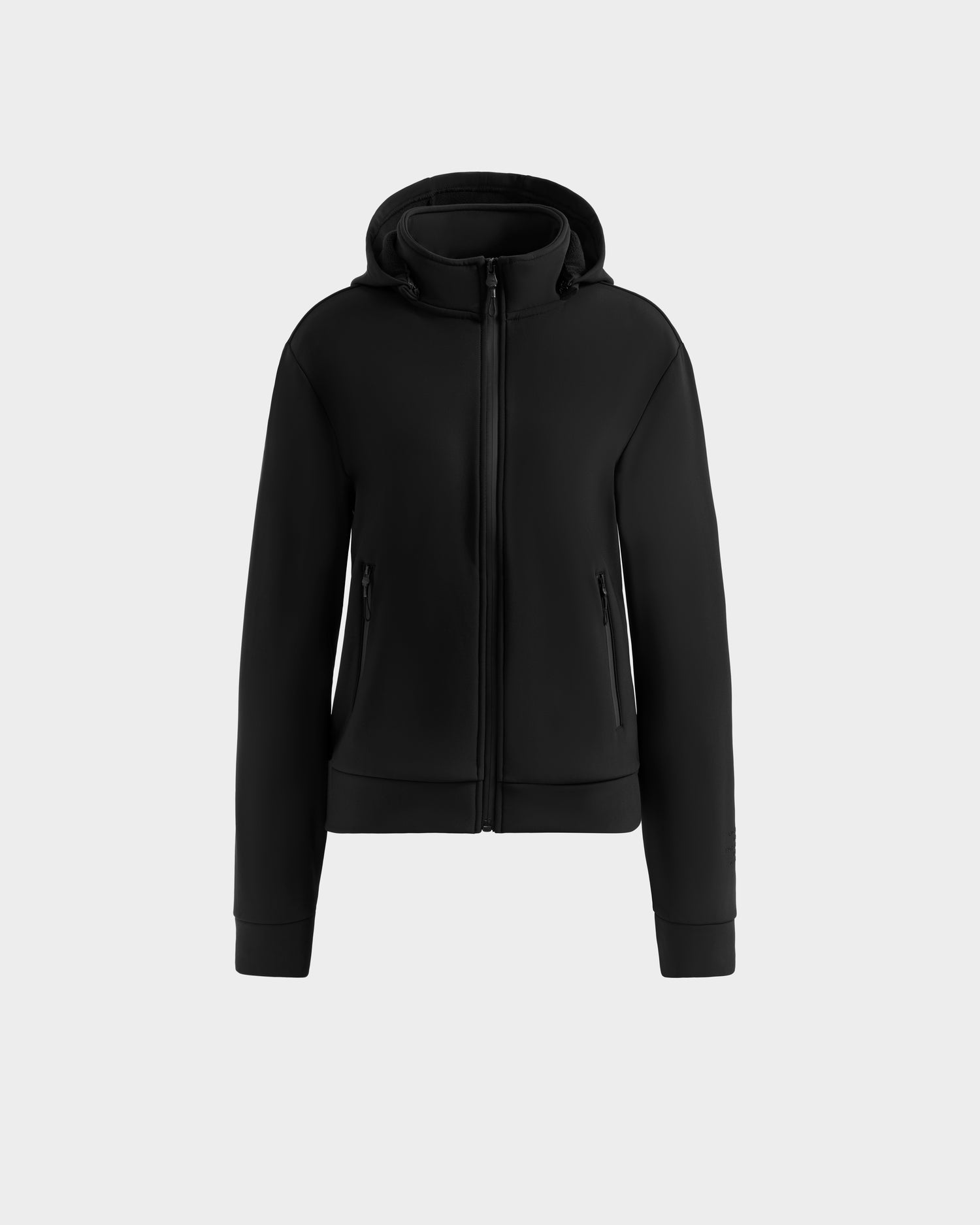 The Rudsak DERIAM - 8525573 Black women’s zip-up sweater jacket features waterproof zippers, a hood, side pockets, and a fitted design with ribbed cuffs and hem, displayed against a plain light gray background.