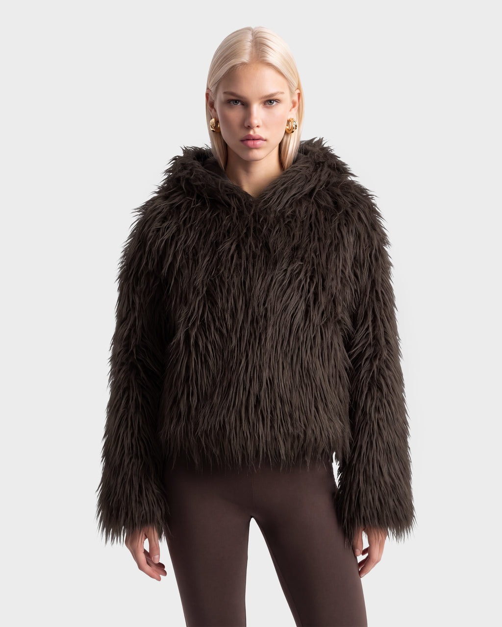 A woman wears an oversized dark brown faux fur hooded ELLISON - 8525678 Espresso jacket.