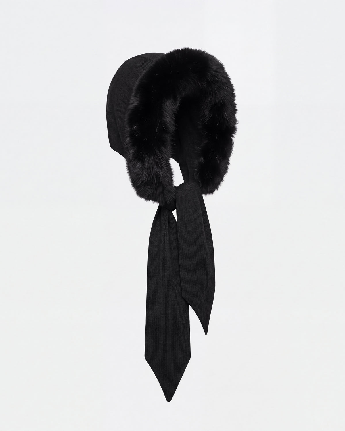 The KARYMA - 8426507 Black by Rudsak is a black winter hood-and-scarf hybrid featuring a thick, plush fur trim and two long fabric ties, shown against a plain white background.