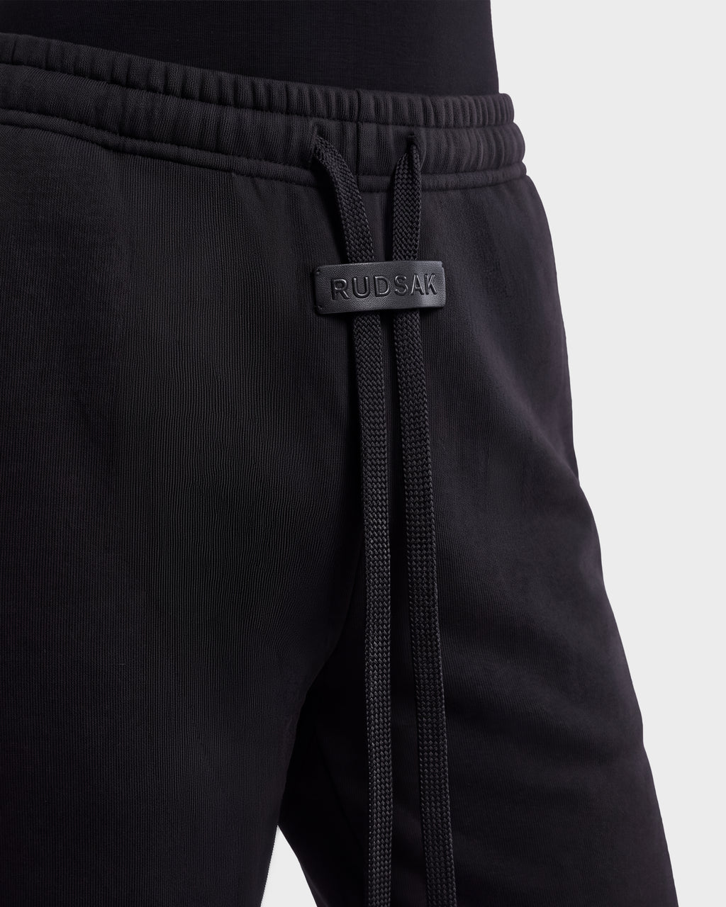 ANGEL - 8526725 Black stretch cotton sweatpants featuring an elastic waistband with a branded leather-like tab and long drawstring cords for a refined off-duty look.