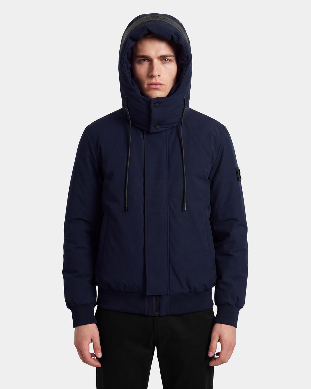 A person is wearing the Rudsak WILL - 6126561 Navy RDS-certified down winter coat with black pants, standing facing forward against a plain white background.
