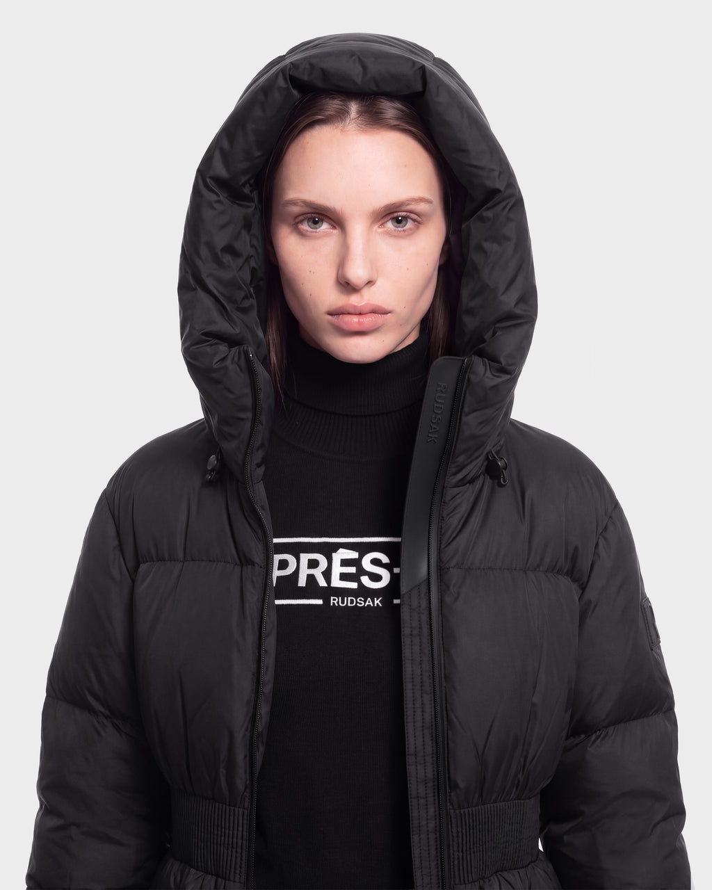 A person wearing the DIAMOND - 8126772 Black jacket by Rudsak and a black PRÉS. RUDSAK turtleneck stands against a plain light gray background.