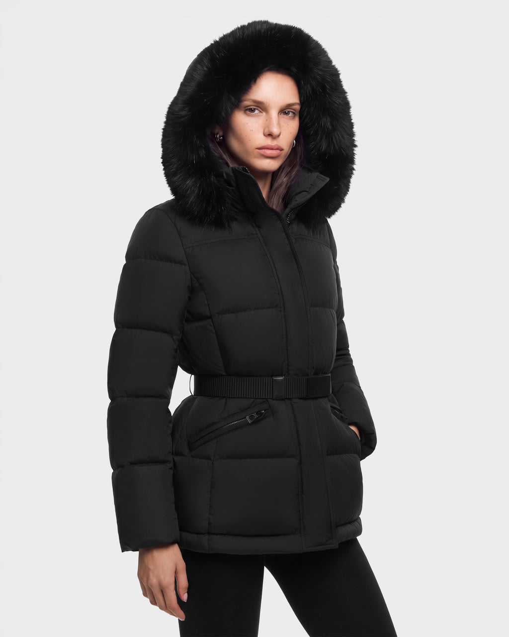 Woman wearing a black Rudsak GRACE FF - 8126535 Black hooded puffer jacket with a belted waist.