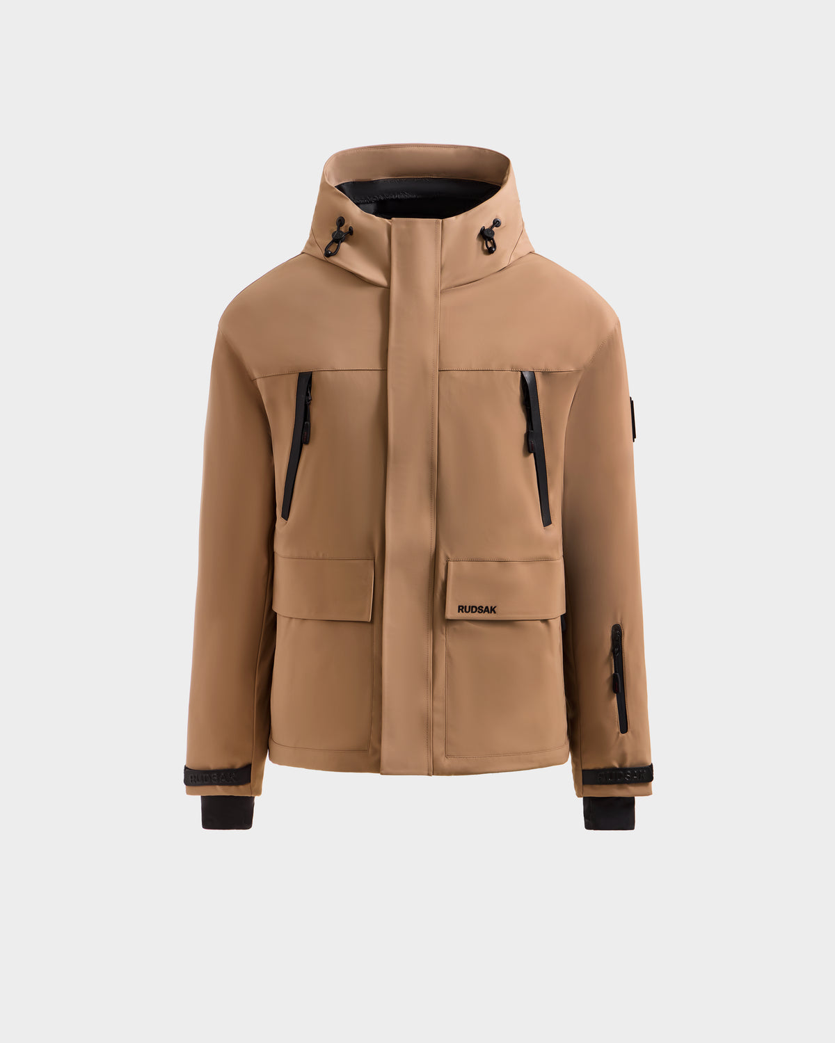 The ETHAN - 6125589 Sand men's ski jacket by Rudsak features black zipper details, front flap pockets, and adjustable hood drawstrings, shown against a plain light background.