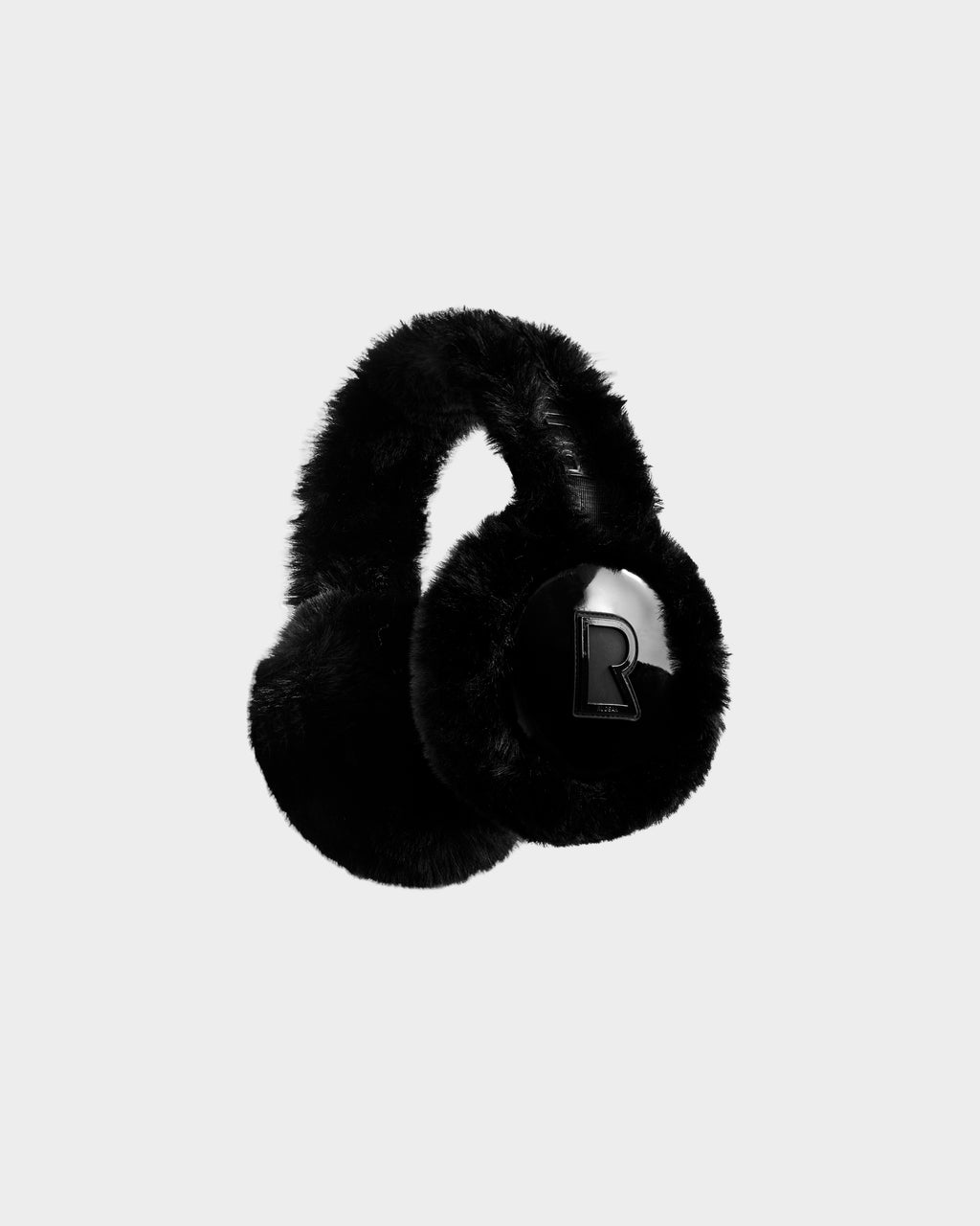 The Rudsak VALENCIA - 8425543 Black earmuffs feature soft black faux fur and a bold letter R on one earcup, offering a cozy, stylish winter accessory displayed against a light background.