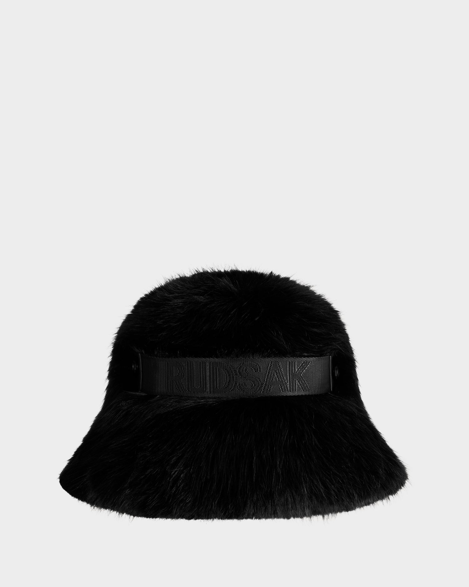 The ROMINA - 8425545 Black by Rudsak is a cozy faux fur bucket hat with a wide brim and an embossed band, perfect for women’s winter wear, shown on a plain white background.