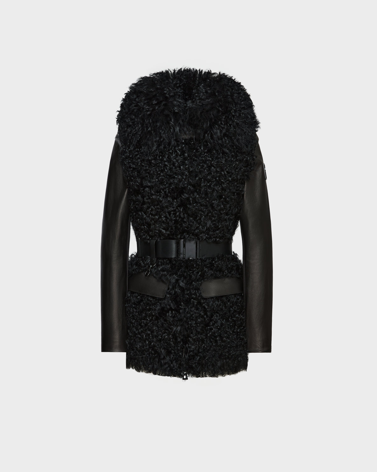 The Rudsak DASHA - 8124809 Black is a women’s leather shearling jacket with curly faux fur on the front and hood, smooth leather sleeves, a wide waist belt, and leather-trimmed pockets, shown on a plain white background.