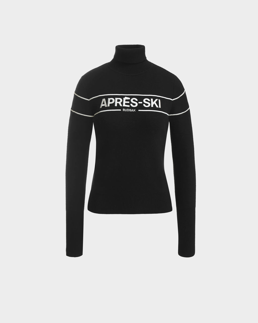 The ERIKA - 8523536 Black OLD sweater by Rudsak features white stripes and bold APRÈS-SKI and RUDSAK lettering—a must-have turtleneck for your winter wardrobe.