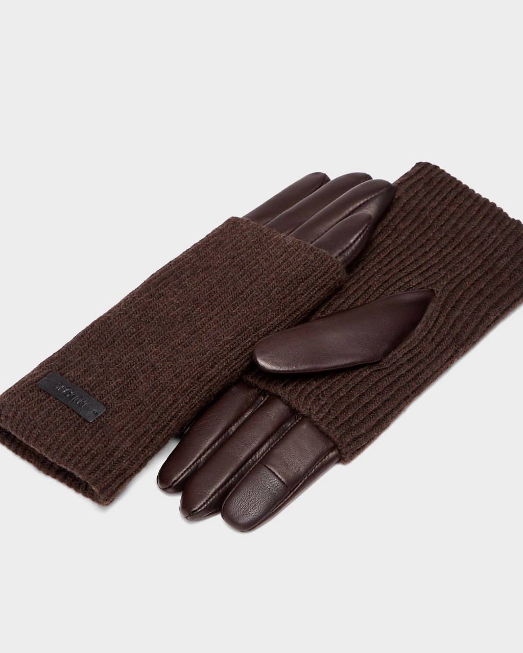 The MARINE - 8424516 Espresso womens leather gloves by Rudsak feature brown leather fingers and palms with ribbed knit backs—stylish fall accessories shown on a light gray background.