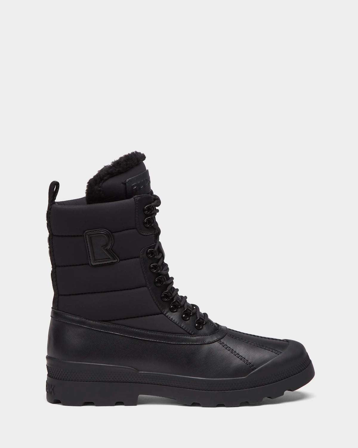 Black mid-calf REAGAN - 6225046 boots by RUDSAK featuring a quilted shaft, lace-up front, faux-fur trim, and a rugged rubber sole.