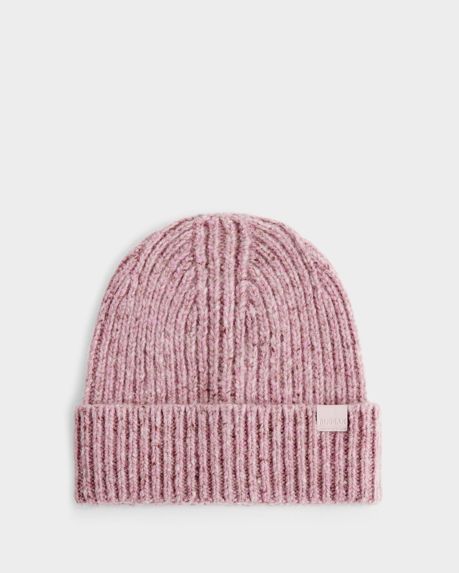 The Rudsak ALINA - L425540 Light Pink women's beanie features a ribbed texture, folded brim, and front tag. Made from wool-cashmere, this winter hat is shown against a plain white background.
