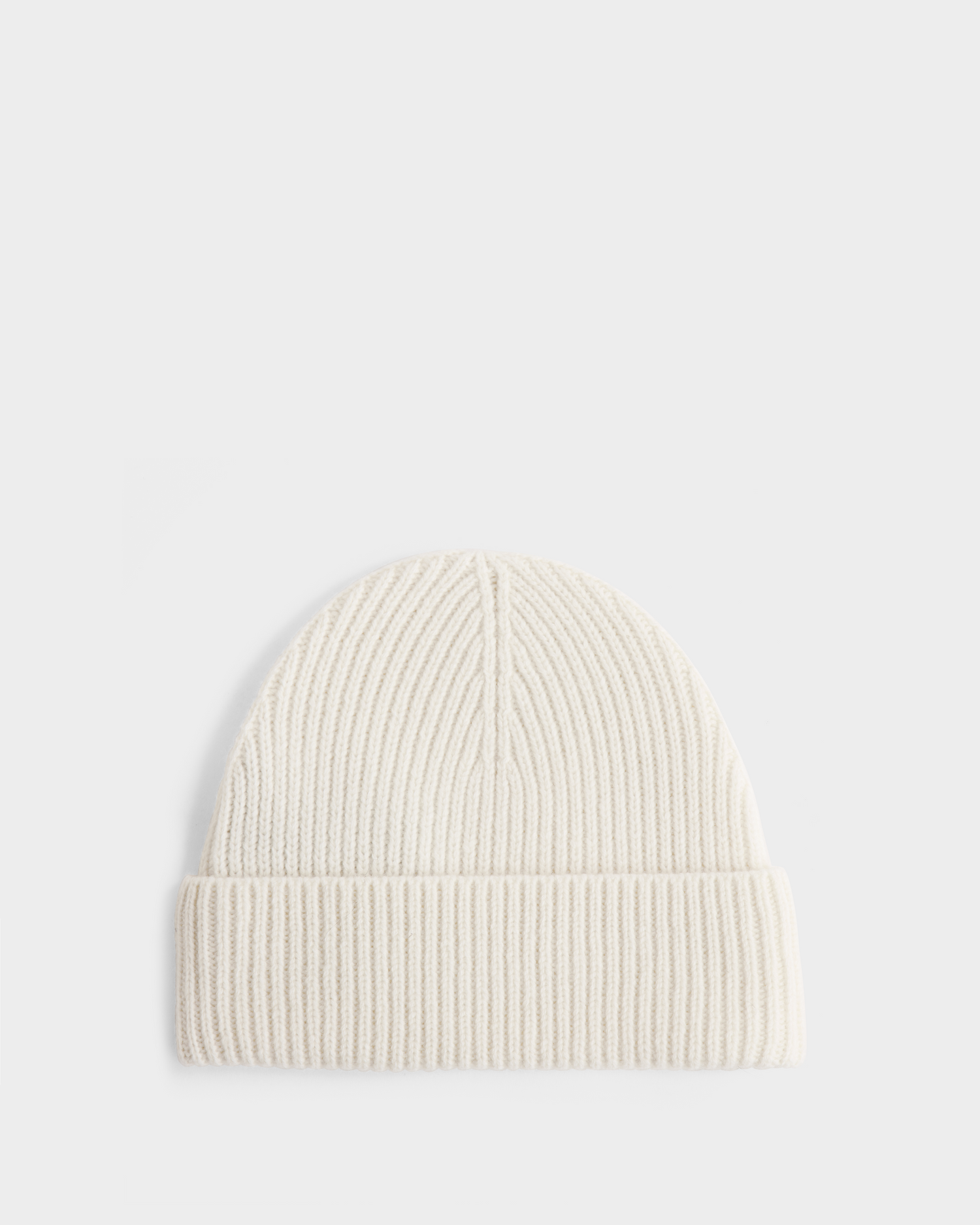 The Rudsak ANDREY - U425507 Vanilla is a cream-colored, unisex rib-knit beanie with a folded brim, shown against a white background—perfect for stylish warmth in cold weather.