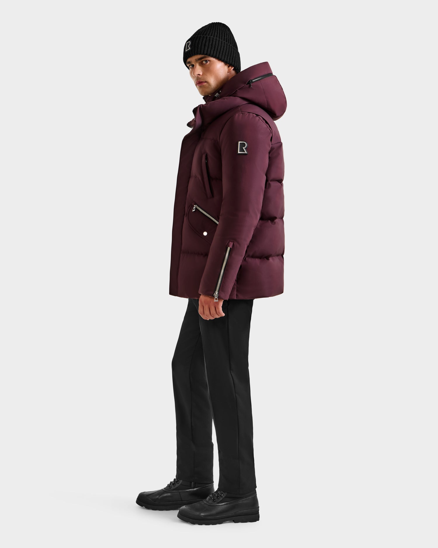 A man wearing the Rudsak APOLLO H - 6125690 Bordeaux winter performance parka.