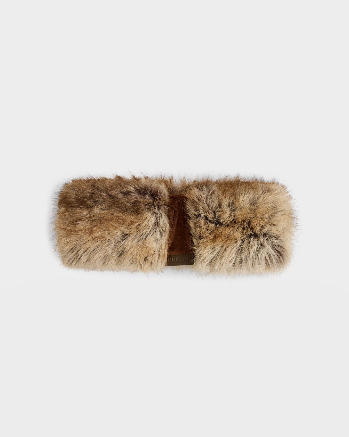 The ARLETTE - 8425544 Mix Mocha by Rudsak is a cozy, rectangular brown and tan muff with a soft texture and center opening, keeping hands warm in style. This winter accessory pops against a plain light gray background.