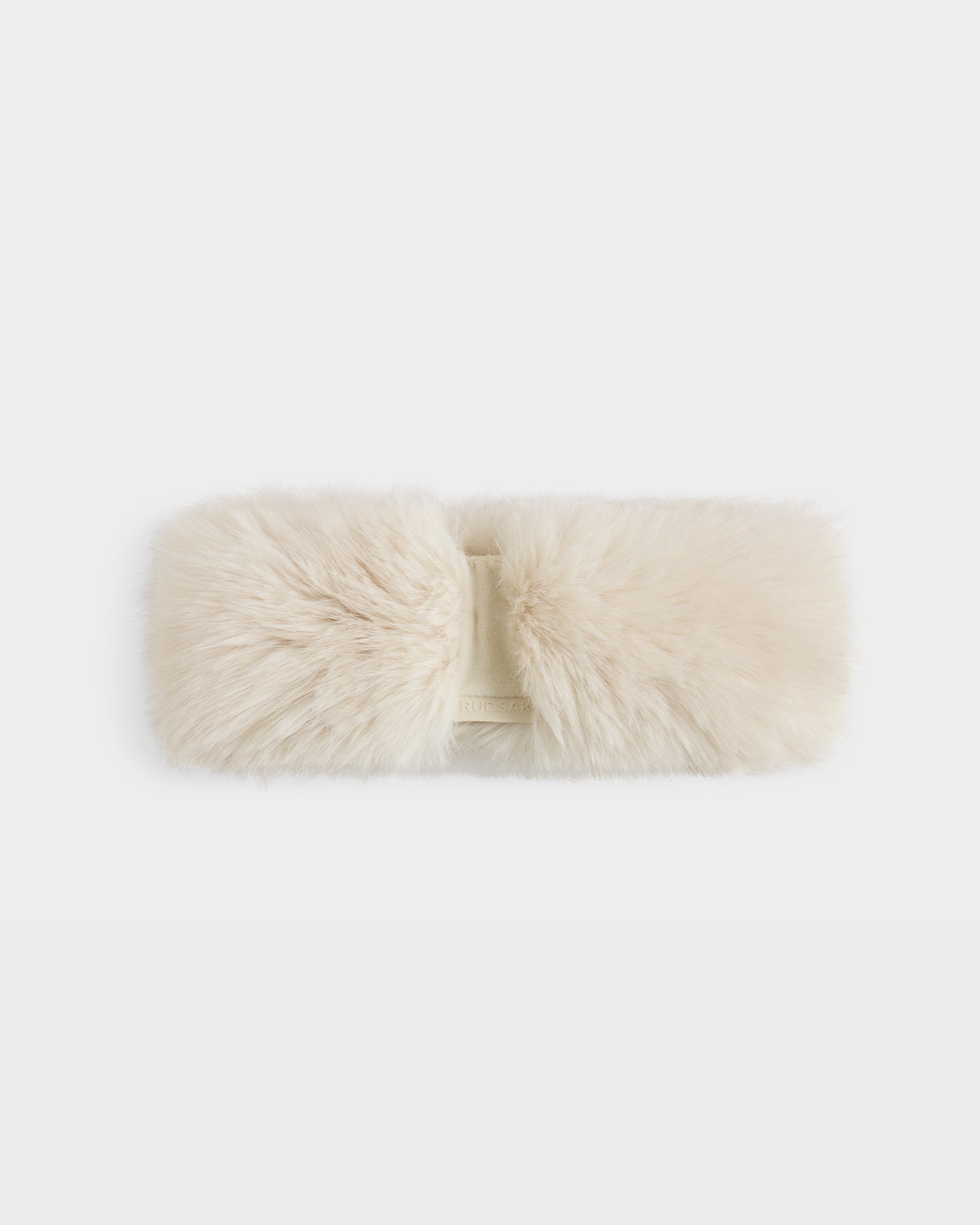 The Rudsak ARLETTE - 8425544 Vanilla women's faux fur headband in cream, with a soft plush texture and twisted center design, is displayed on a plain white background—perfect as a cozy-chic winter accessory.