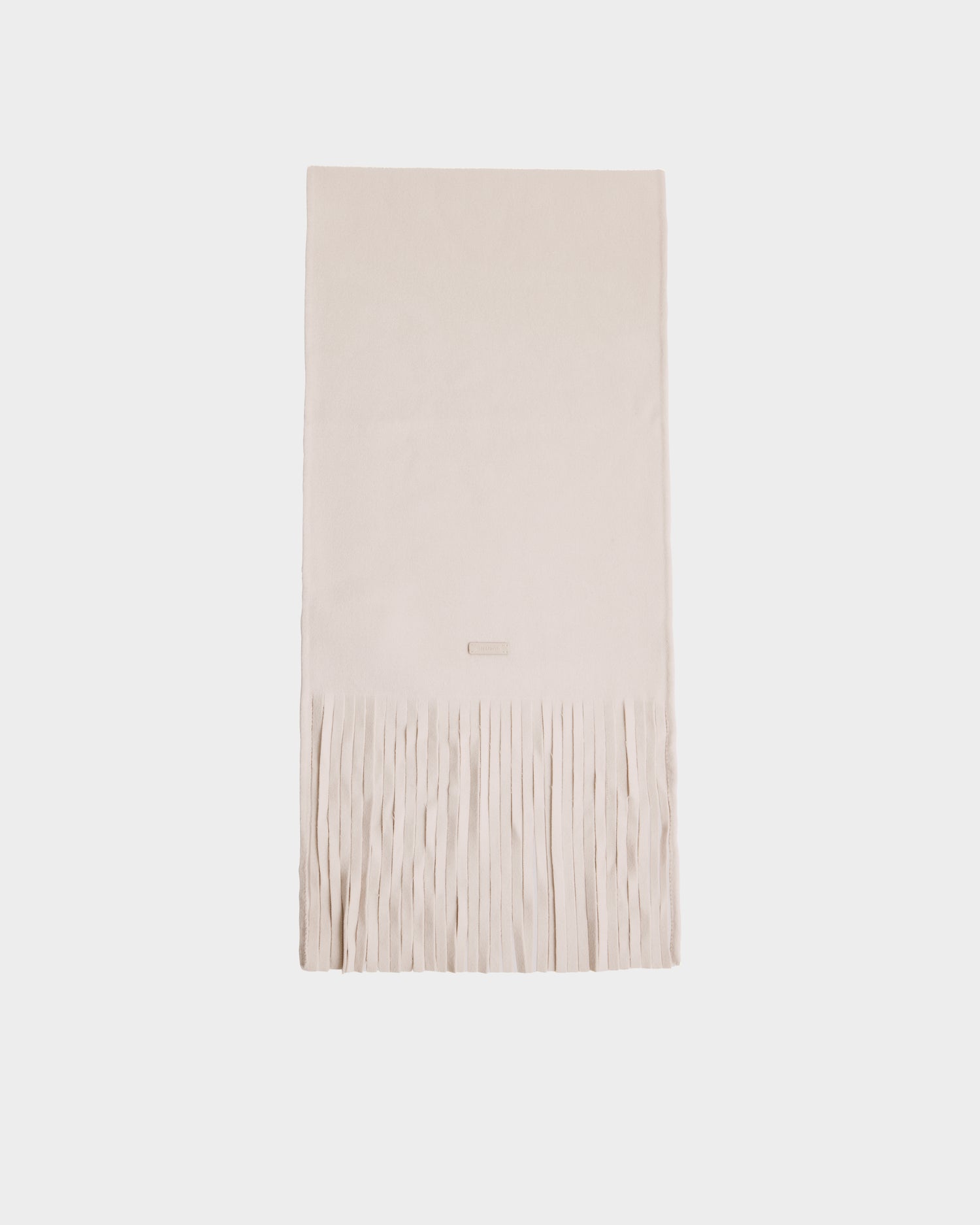 The Rudsak CALEN - 8425532 Vanilla is a cream-colored unisex wool-blend scarf with long fringes, shown laid flat on a plain white background—perfect as a cozy cold-weather accessory.