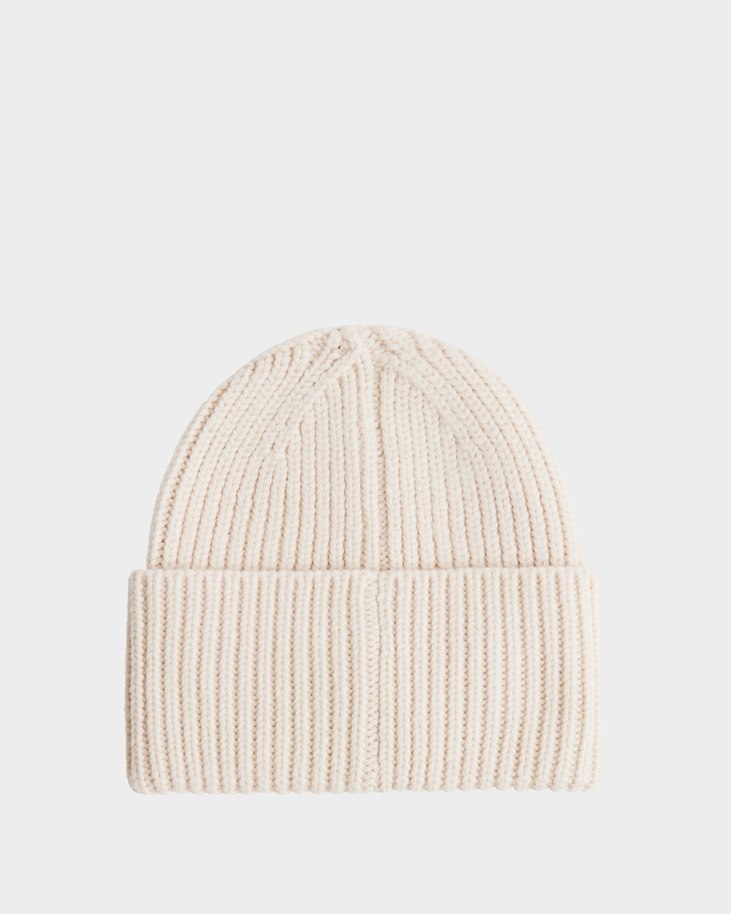 The COLIN - 9424518 Vanilla beanie by Rudsak is a cream ribbed knit unisex hat, crafted from soft merino wool with a folded brim, shown on a plain white background.
