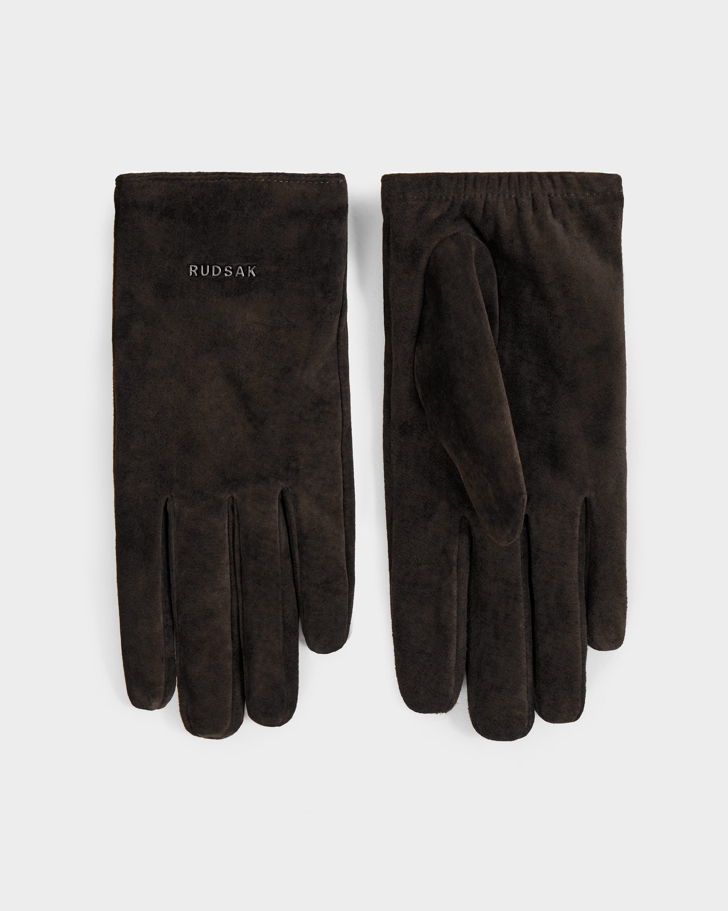 The Rudsak FLORA - L425542 Espresso women’s suede gloves feature a wool-cashmere lining for warmth and have RUDSAK embroidered in white on the left glove, shown against a plain white background.