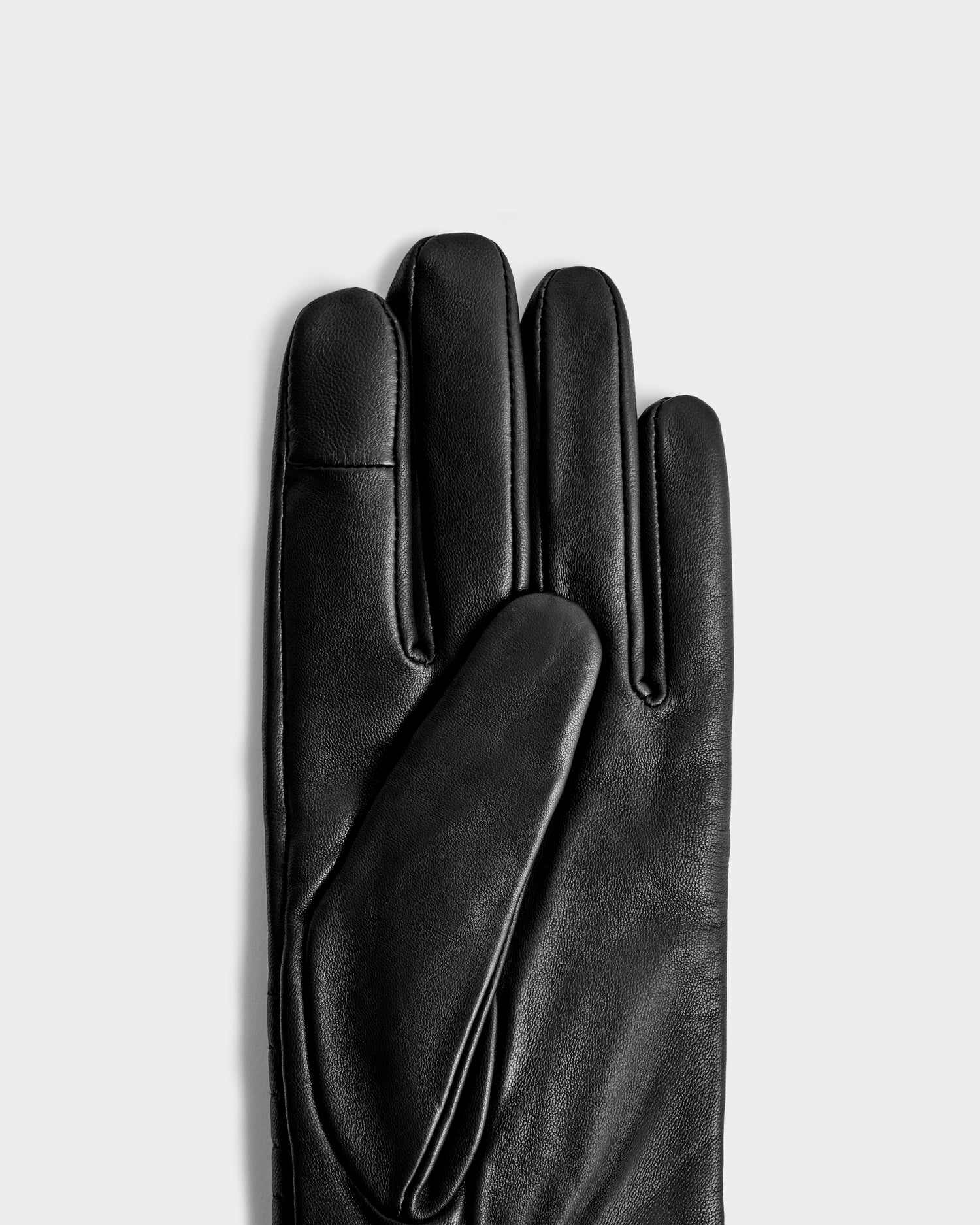 The Rudsak GEMMA - 8425008 Black glove, a classic leather winter accessory, is displayed palm-up and fingers extended on a light gray background, with only one glove shown in the image.