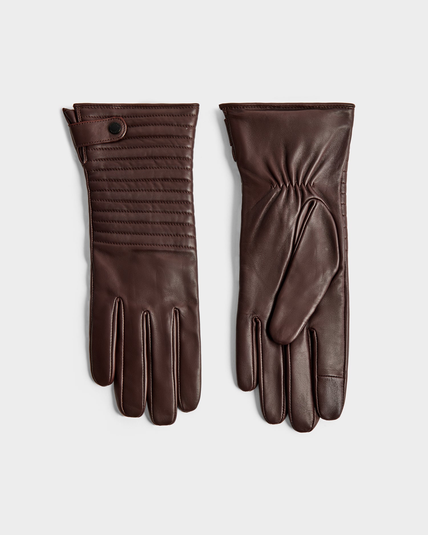 The Rudsak GEMMA - 8425008 Espresso gloves are stylish brown leather winter accessories, featuring stitched detailing and a snap button strap on the front of one glove and a plain palm side on the other.