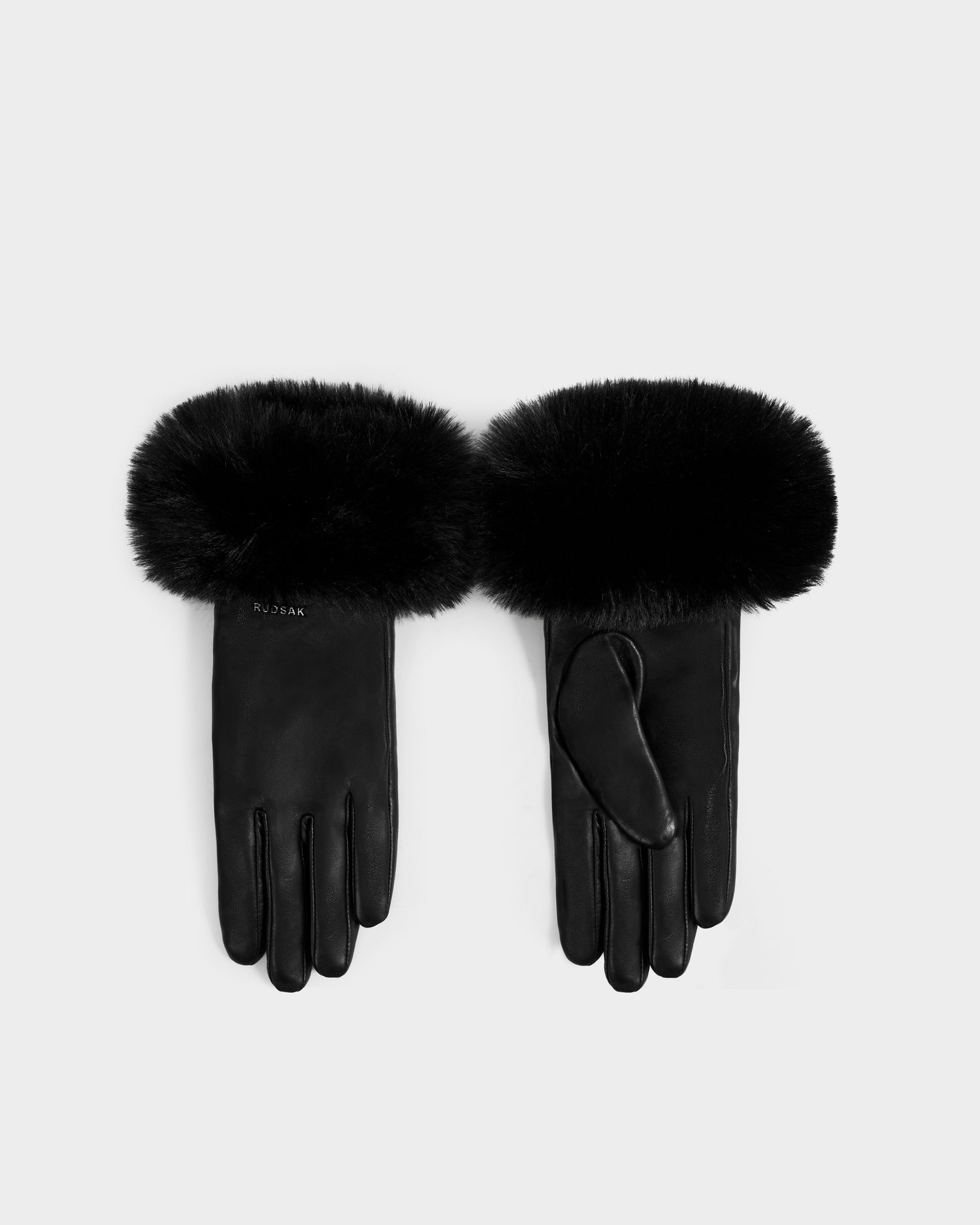 The GERRY - L425550 Black women’s gloves by Rudsak are crafted from supple lamb leather with thick, fluffy black faux-fur cuffs, shown palm up and palm down on a light gray background.