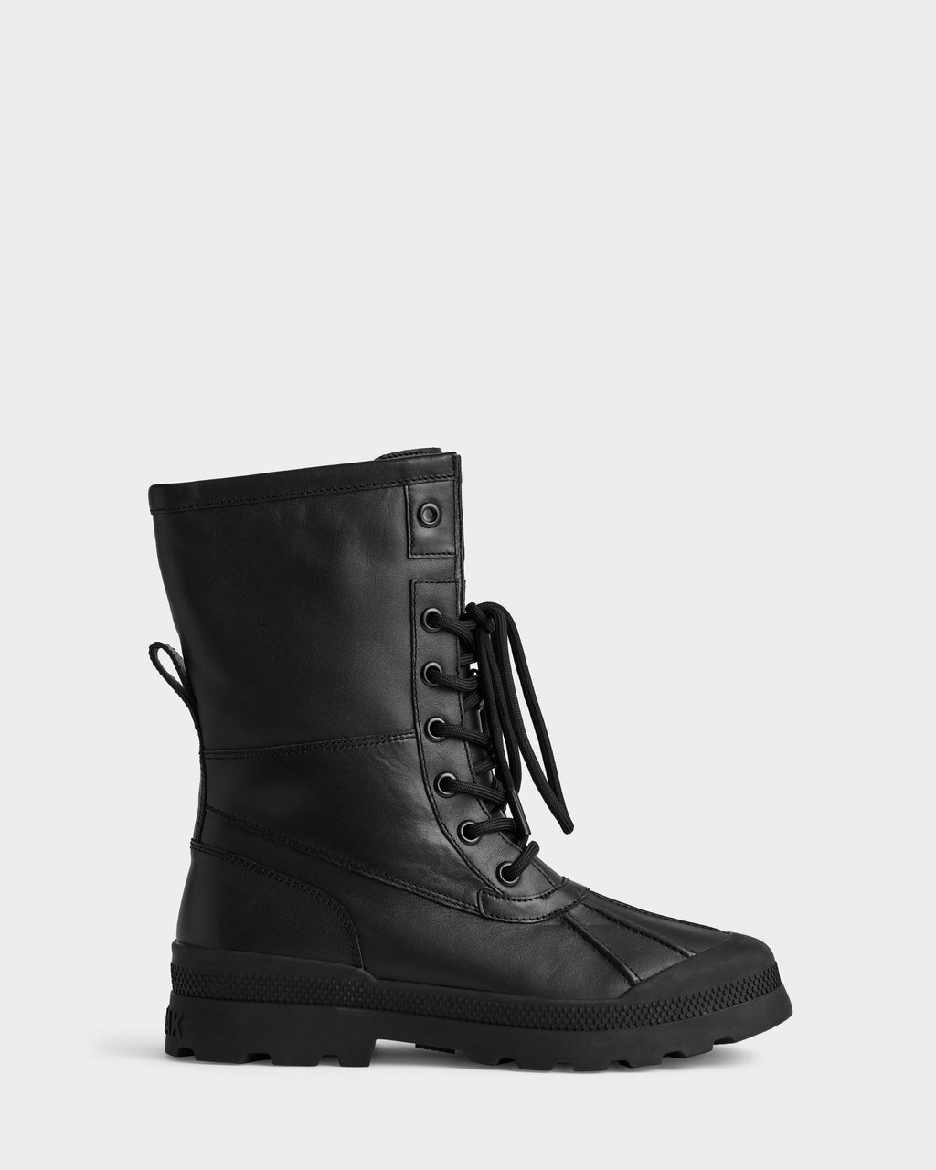 The Rudsak JESI - 8225026 Black is a black lace-up combat boot with a thick textured sole, side stitching, rear pull tab, and metal eyelets, shown against a plain light gray background.