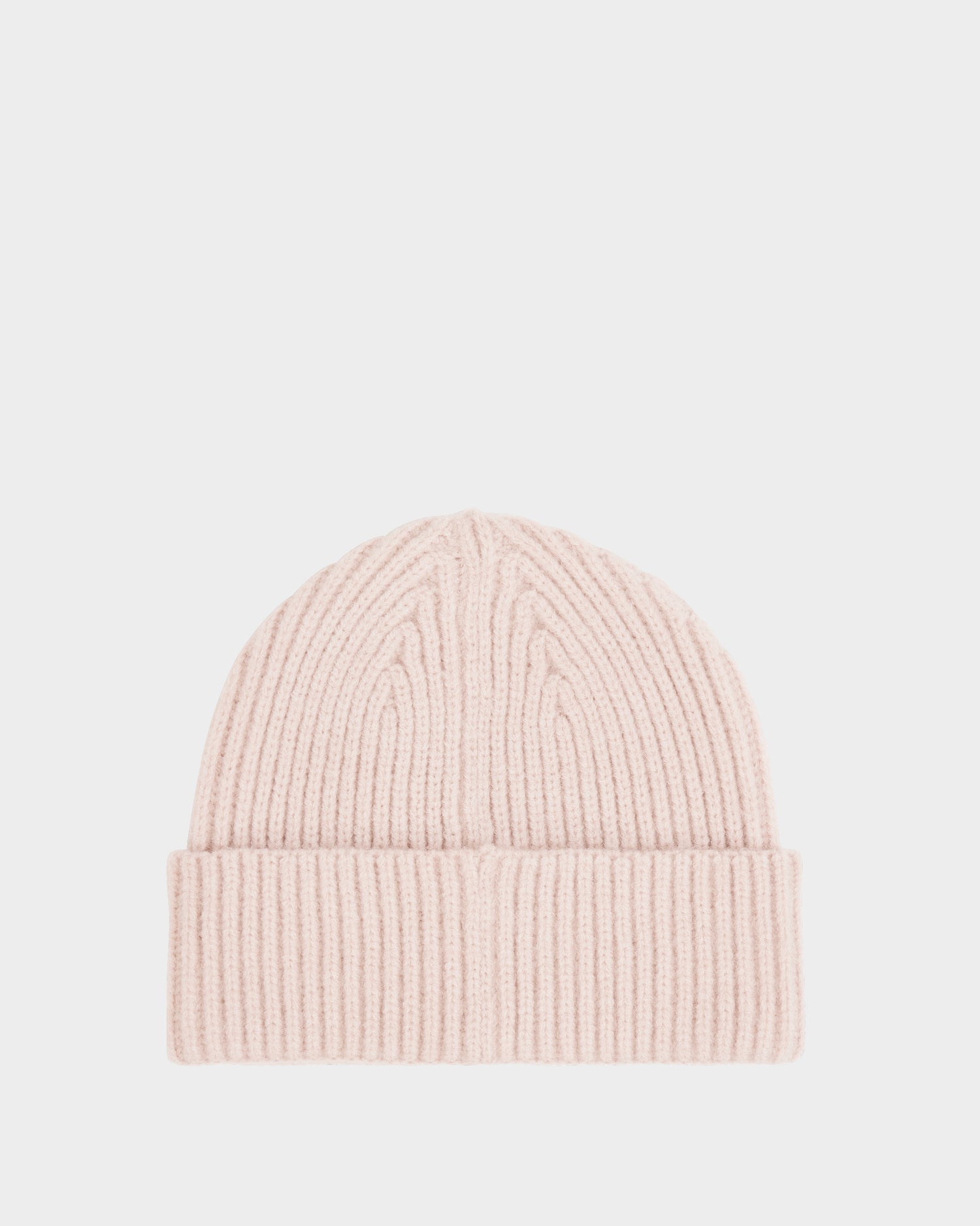 The JULIO - U423502 Vanilla is a light pink unisex knit beanie by Rudsak, designed with a ribbed texture and folded brim—an ideal winter essential, shown against a plain white background.